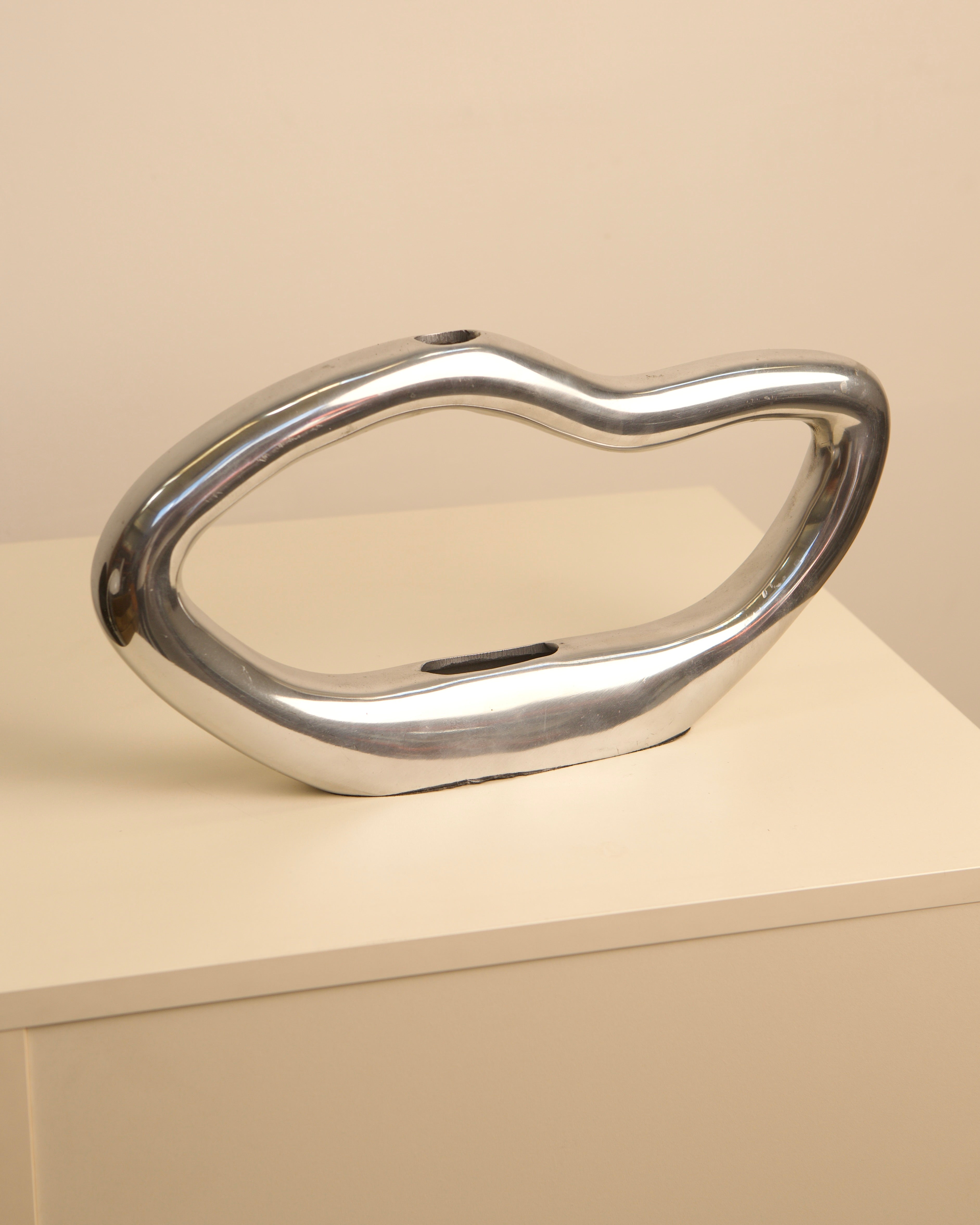 Onde chrome-finish sculptural vase with organic curved form 80s