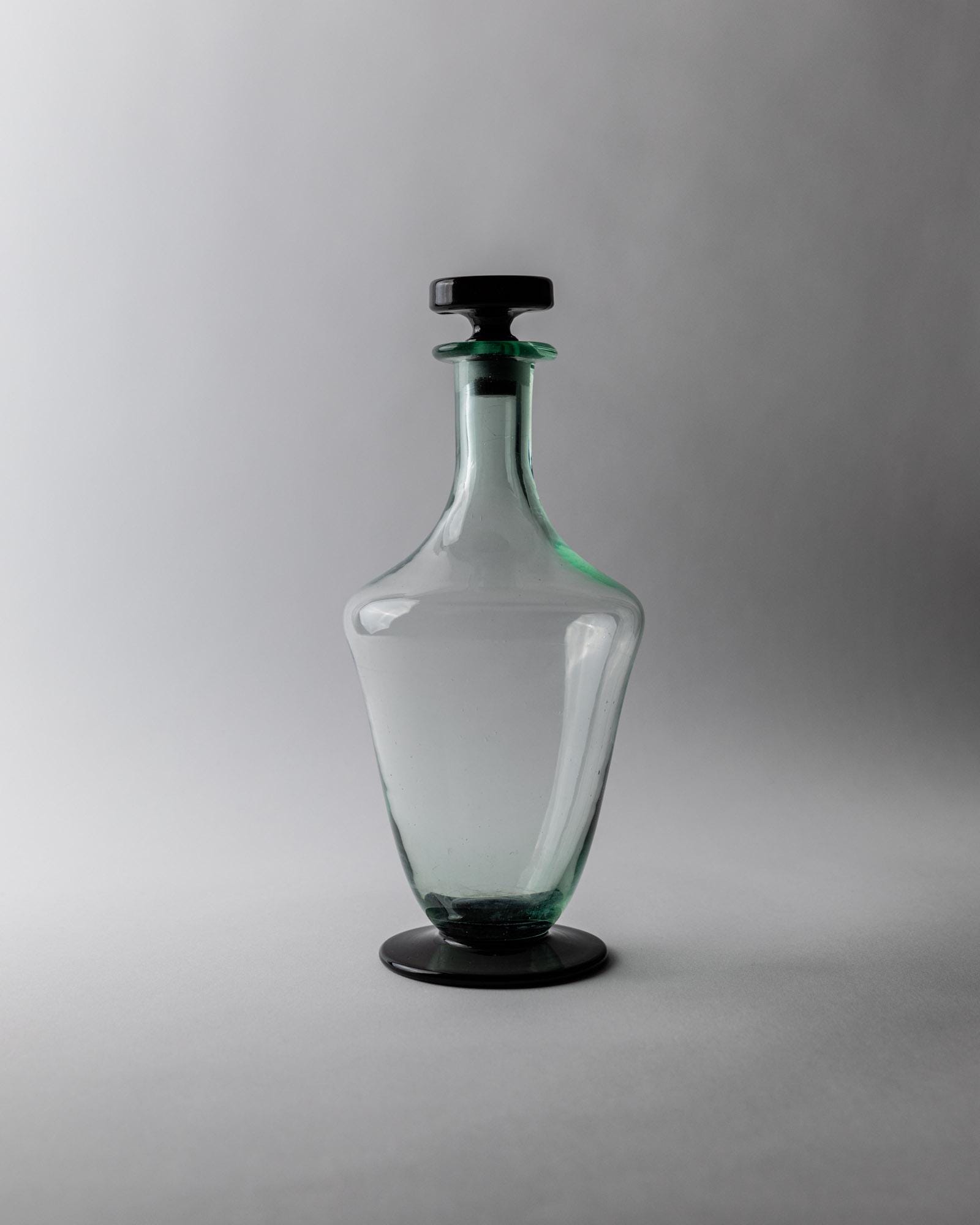 1960s Murano Glass Decanter — front view highlighting clear glass and black base