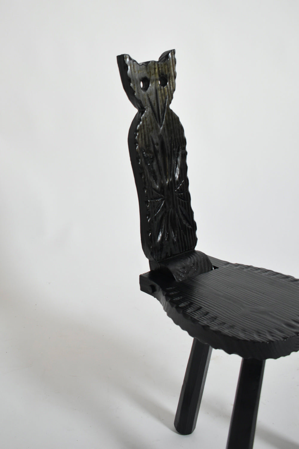 Pair of Brutalist Ebonised Wood Owl Chairs, 1960s — angled view highlighting carved owl backrest