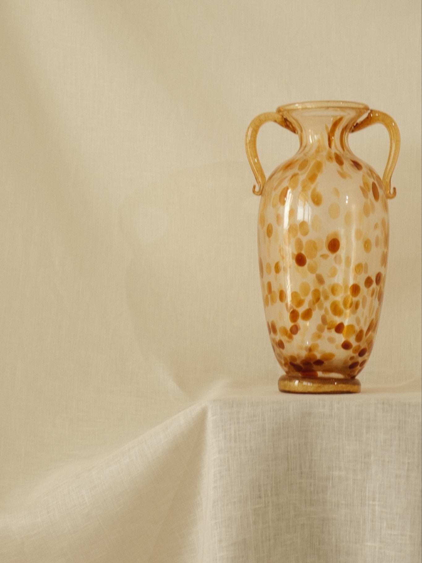 Amber Spotted Glass Amphora Vase — lifestyle setting