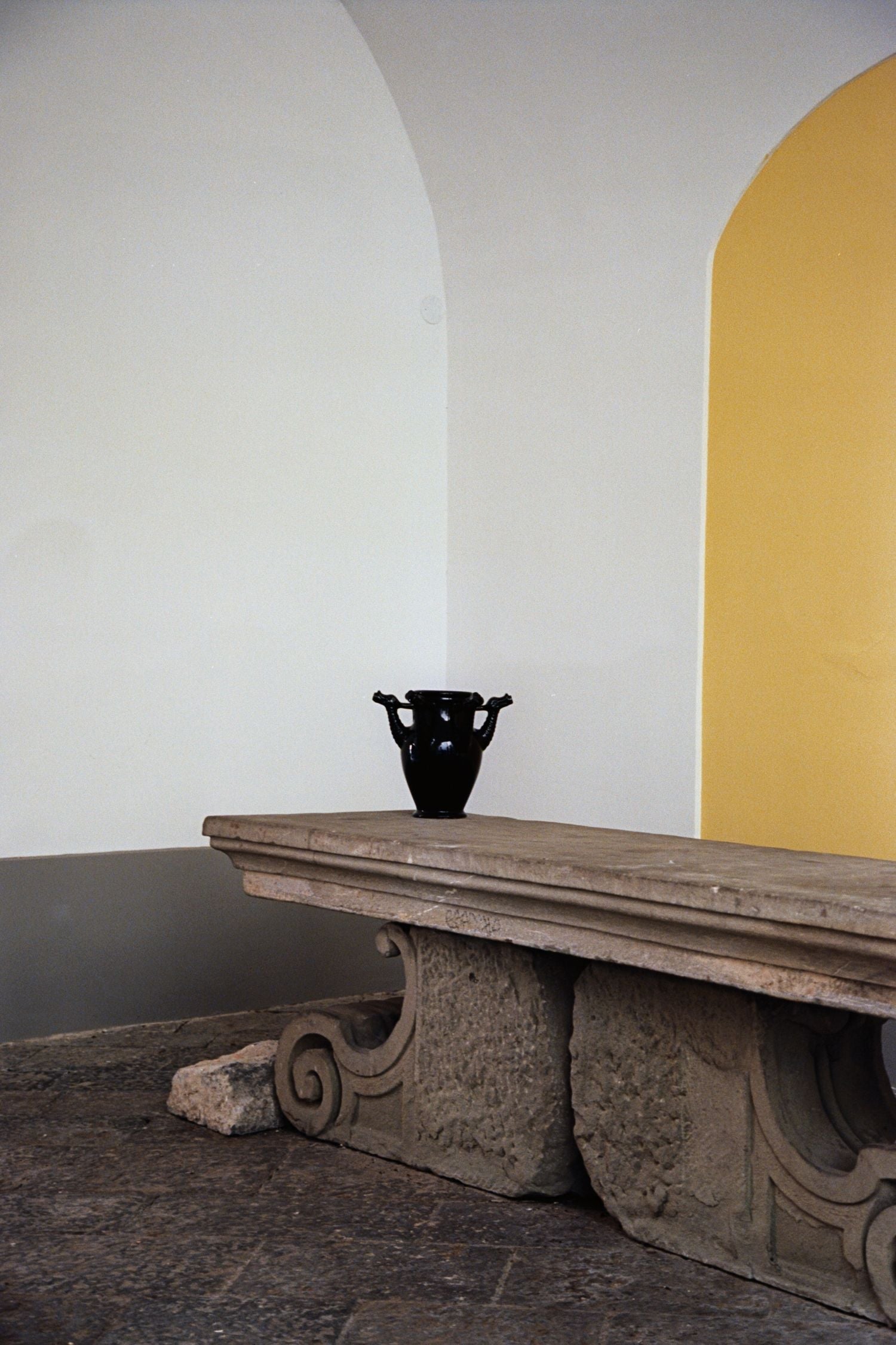 The Drago Nero - Minimalist Vase in Ceramic — positioned on stone table in neutral setting