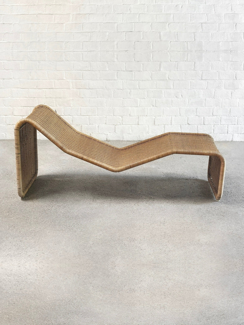 Woven rattan P3 lounge chair by Tito Agnoli, curved flowing design