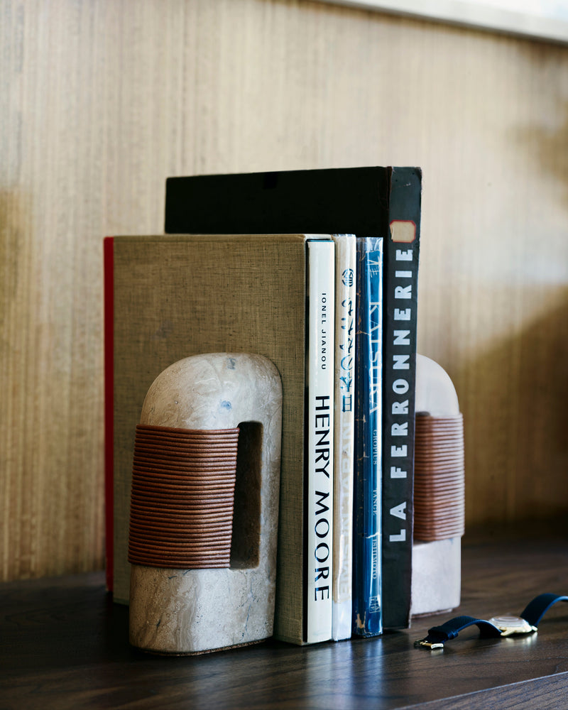 Fane concrete bookend with copper wire wrapping holding design books