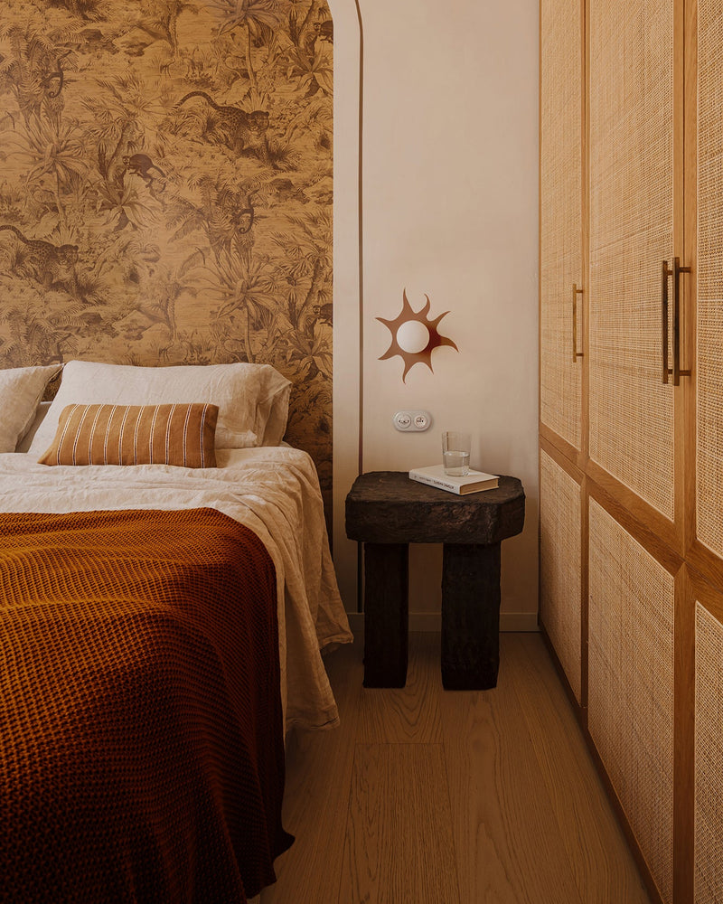 Ruins nightstand by Szymon Keller in bedroom setting with wallpaper