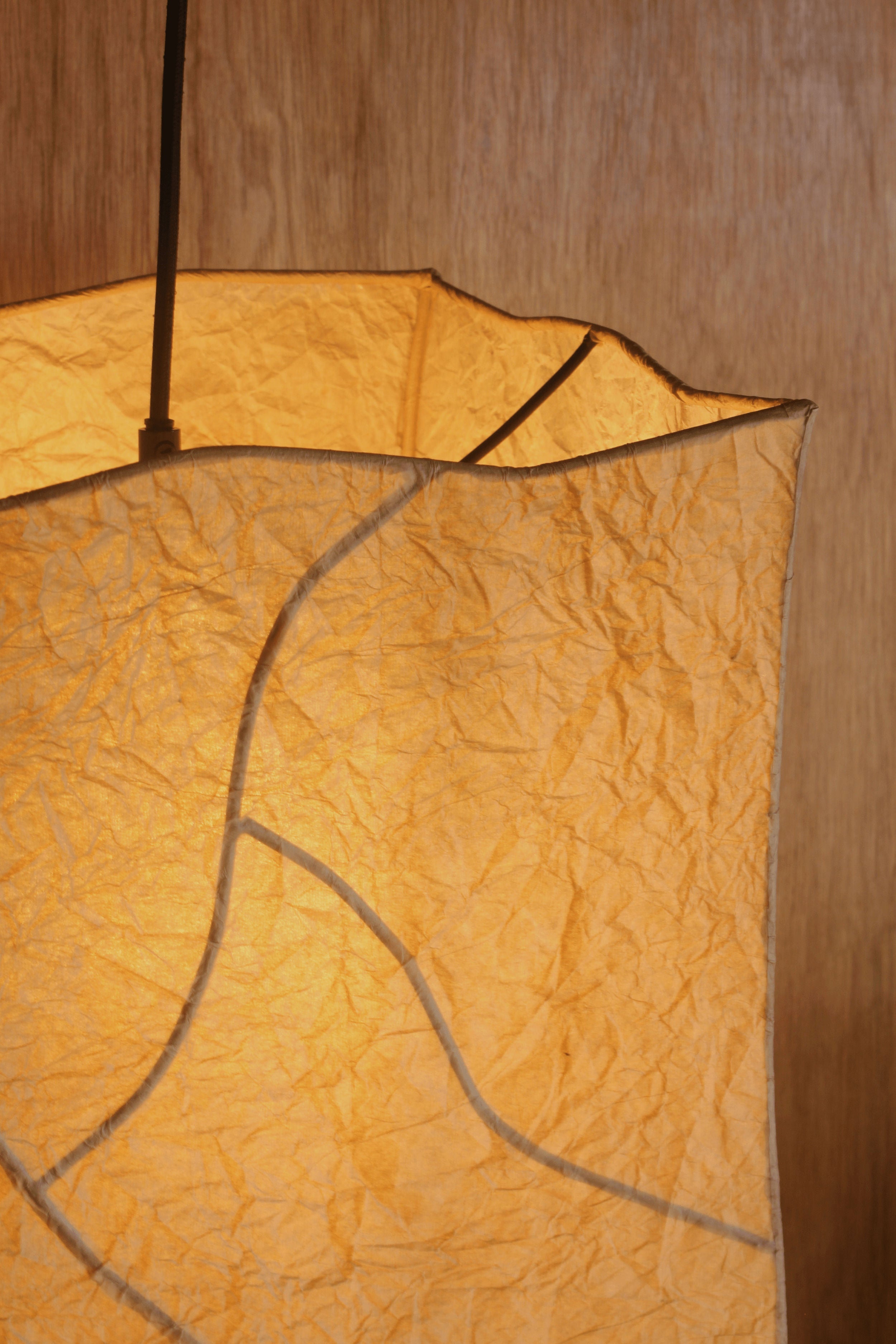 Hanging Dolmen' Pendant Light — close-up of textured paper shade