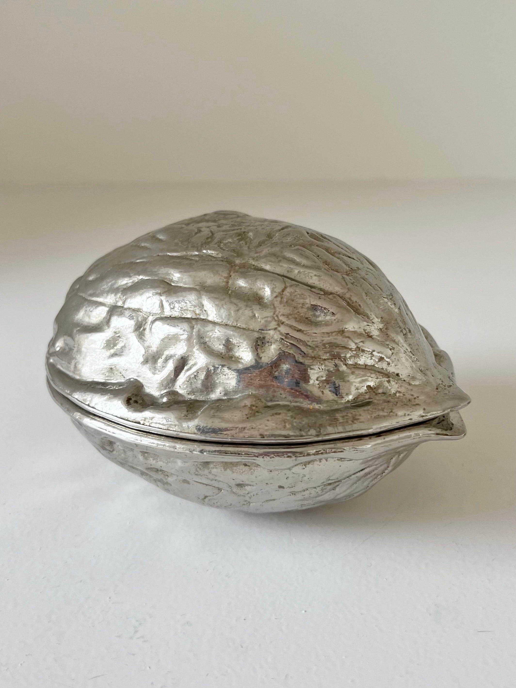Nutcracker — side angle of silver-toned metal design