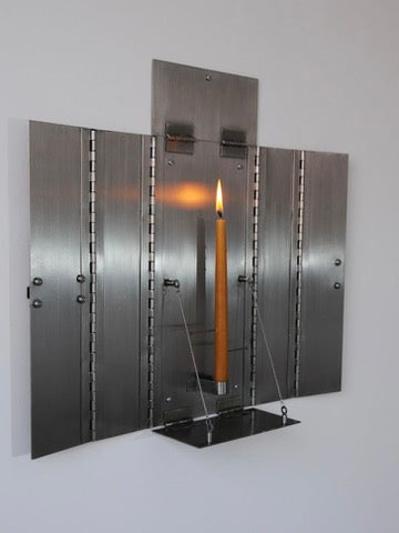 Wax Clock' Wall Candleholder — top view of metal design with lit candle