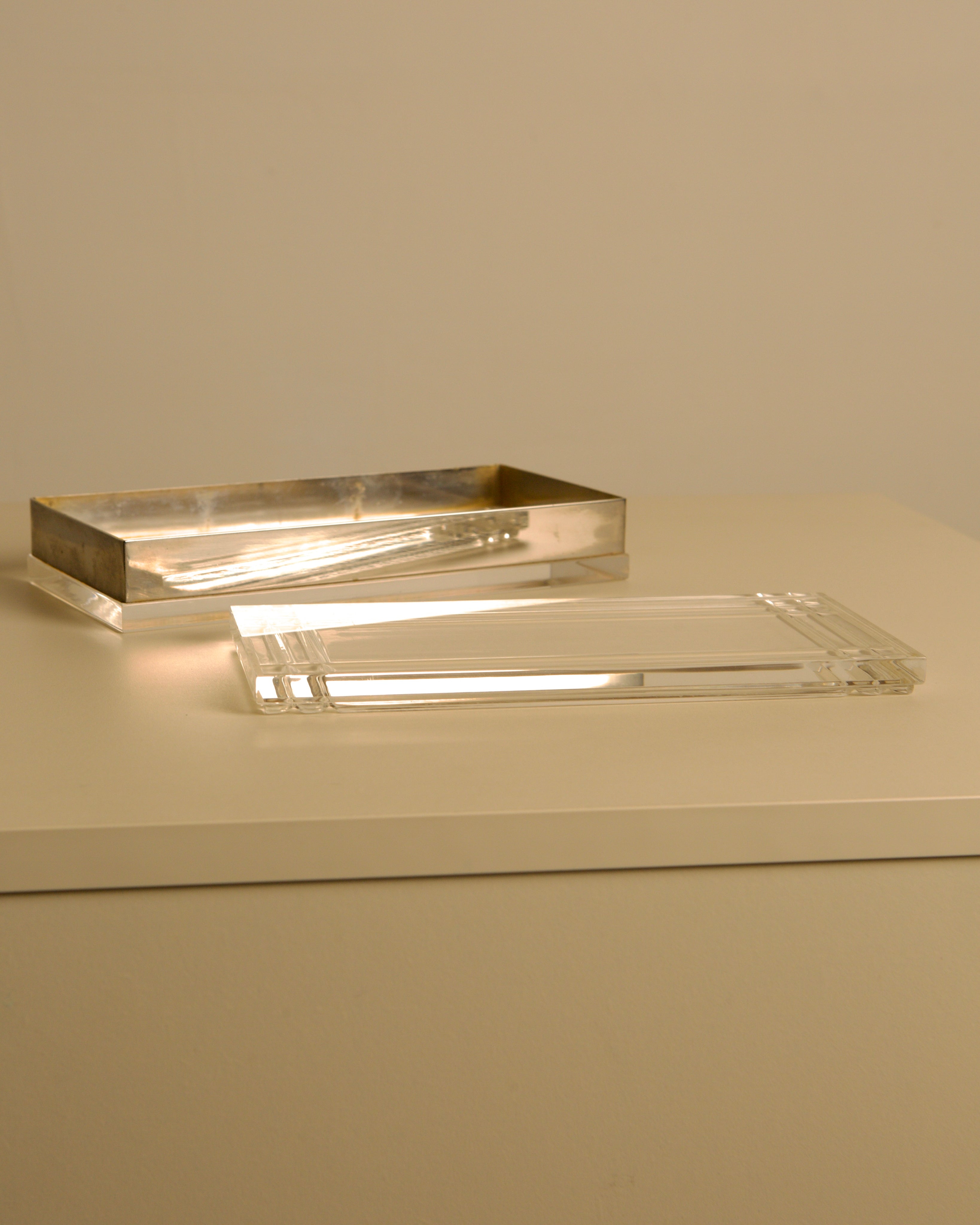 Large Rectangular Italian Silver and Plexiglass Box 70s — angled view of silver and clear plexiglass materials
