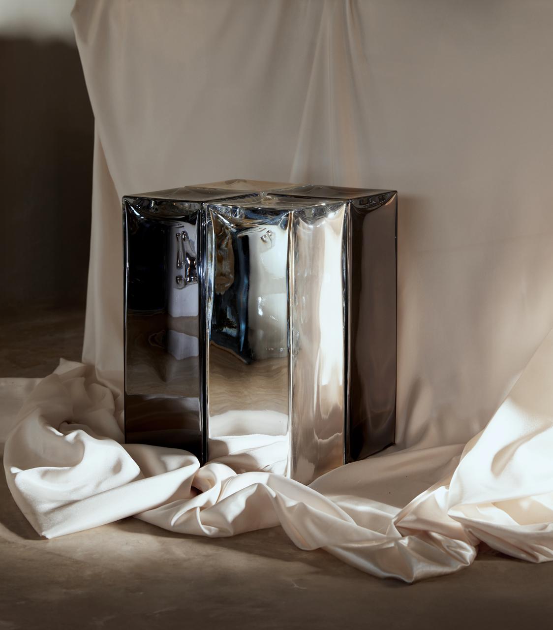 MONOLIT' Stool / Side Table — angled view on draped fabric
