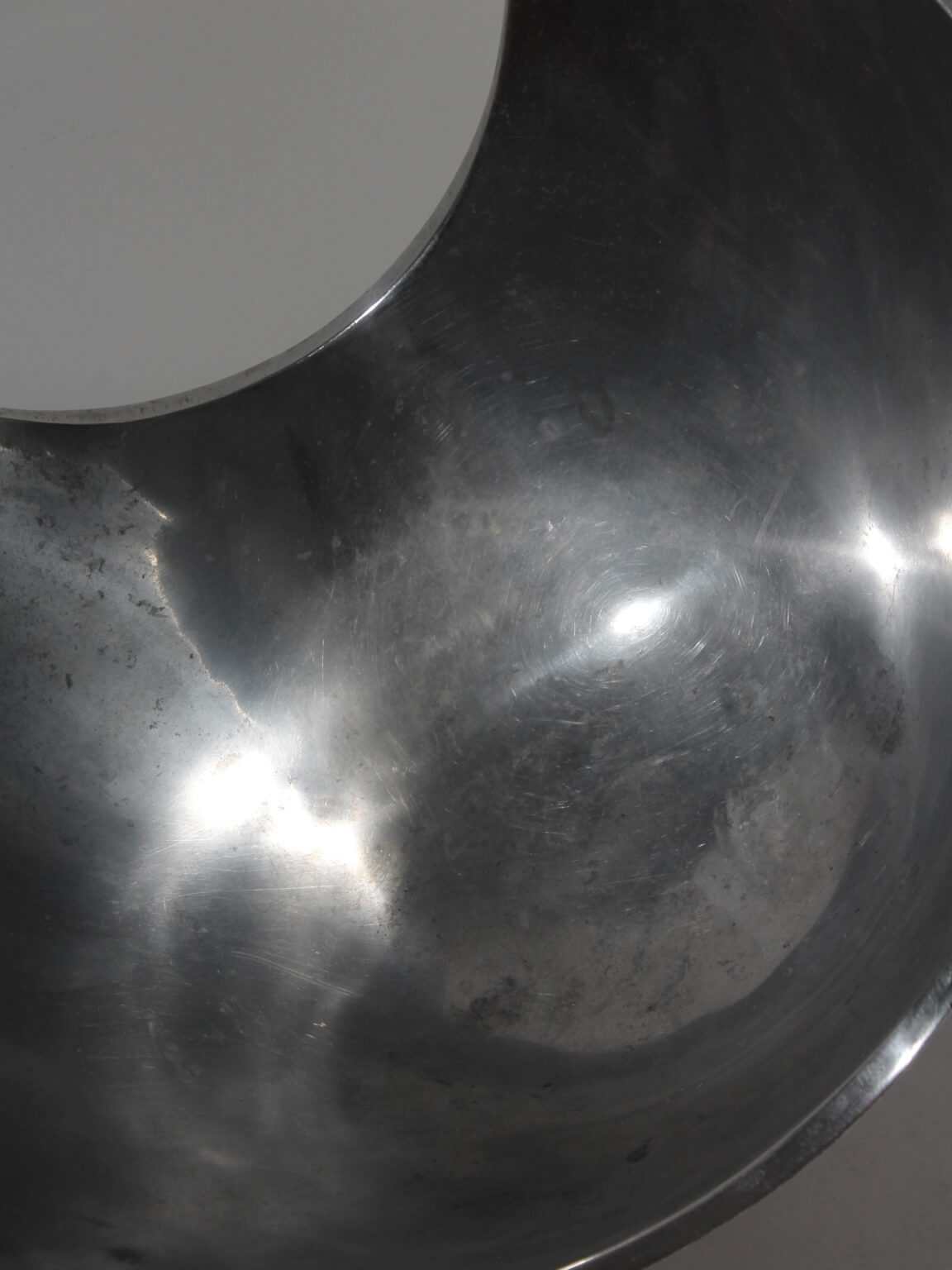Polished Aluminum Asymmetric Contemporary Large Deep Bowl — close-up of polished aluminum surface