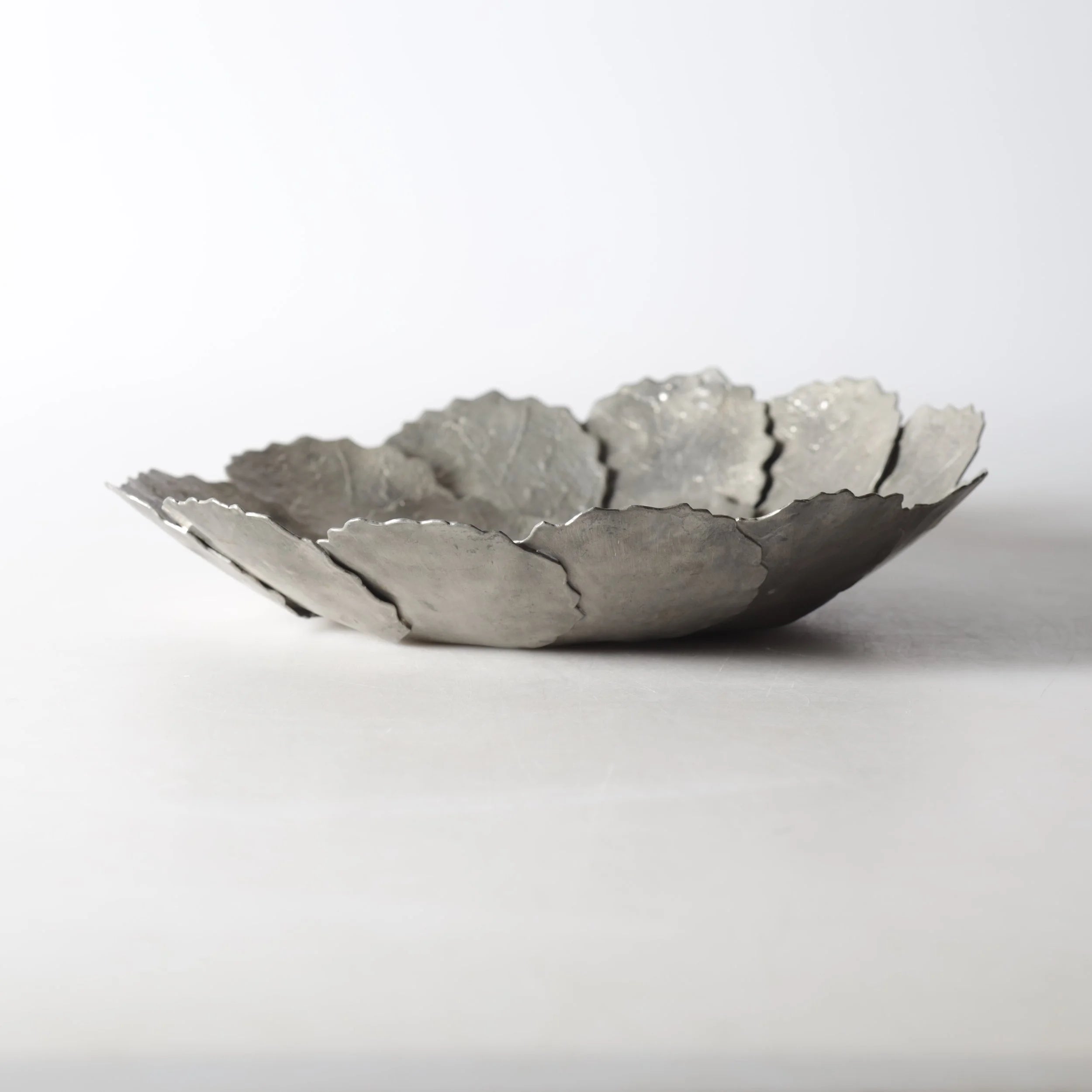 A large decorative 'Höstlöv' pewter dish, (1973) — detail view