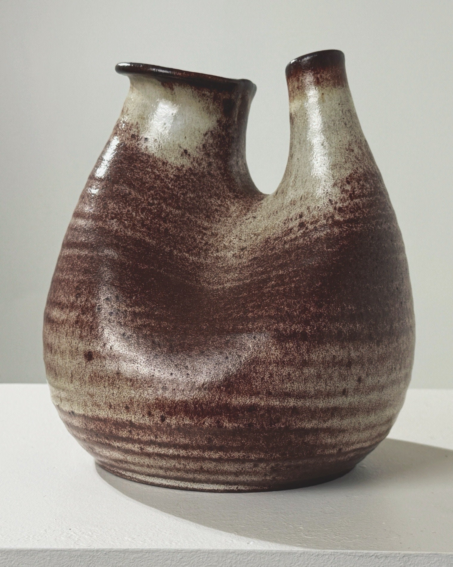 Brown and beige ceramic zoomorphic vase with dual spouts by Accolay