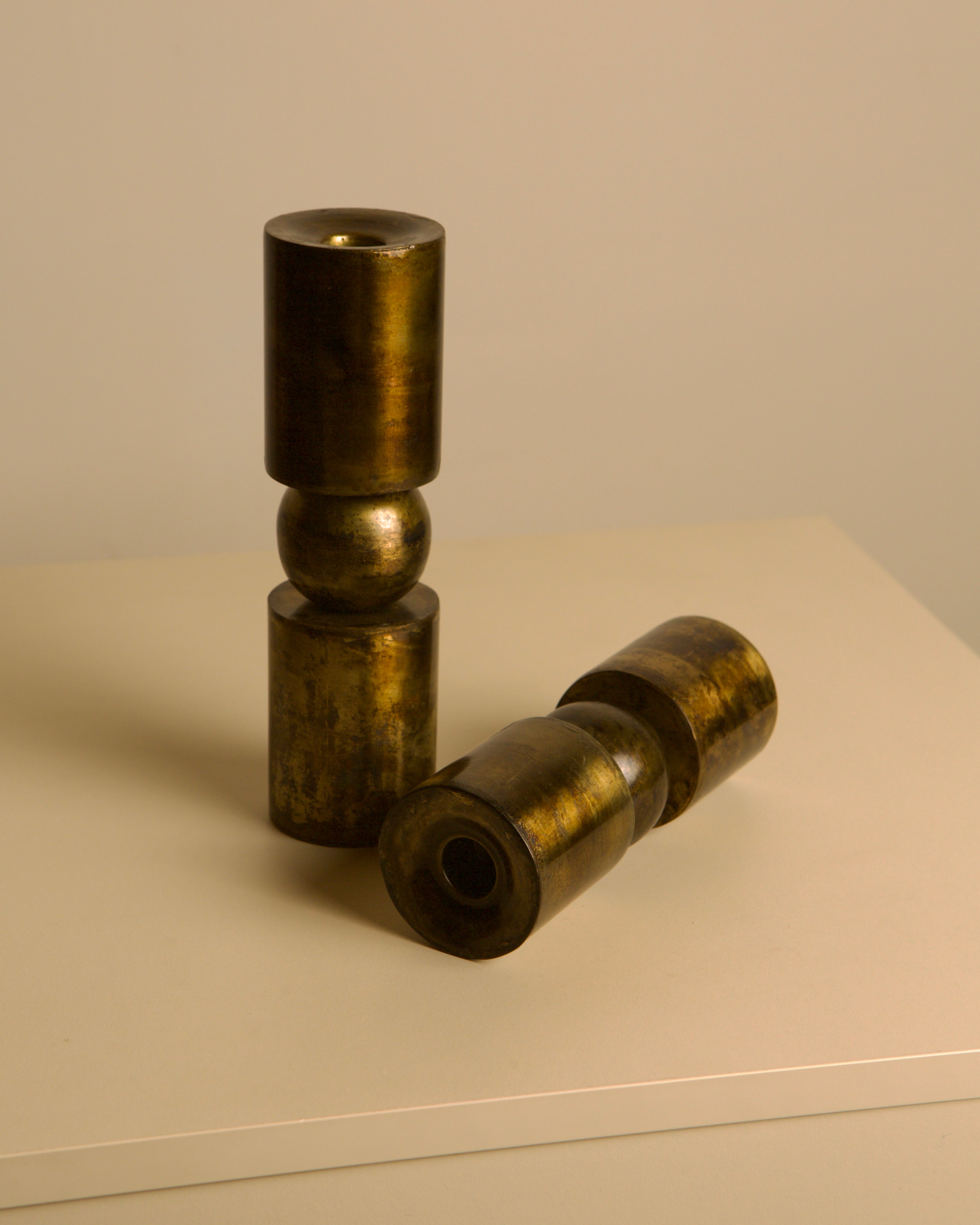 Pair of Danish copper-plated metal candlesticks from the 80s — side angle