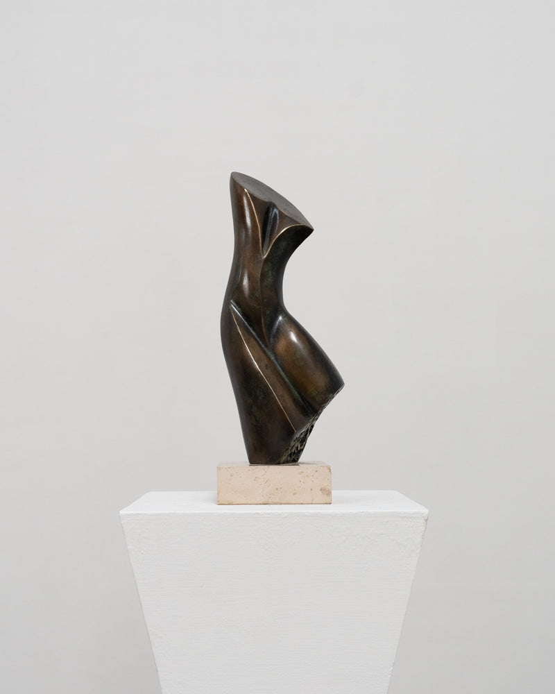 Abstract bronze sculpture with curved flowing forms by Stanislaw Wysocki