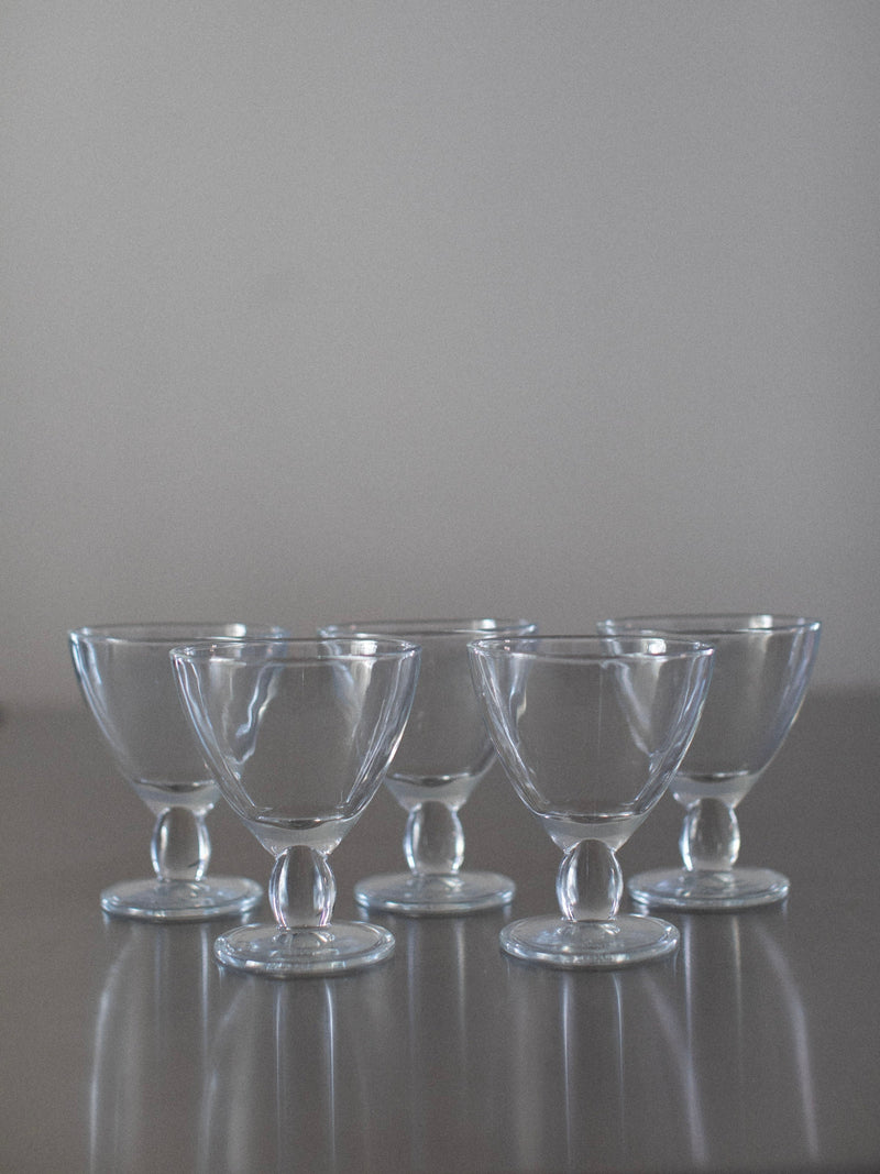 Set of five clear glass Italian dessert cups with pedestal bases