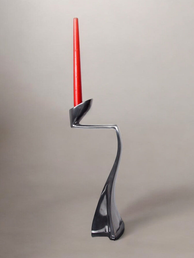 Swan Candleholder by Matthew Hilton, England, 1980 by Malamar Studio | The Oblist — handcrafted metal, red candle