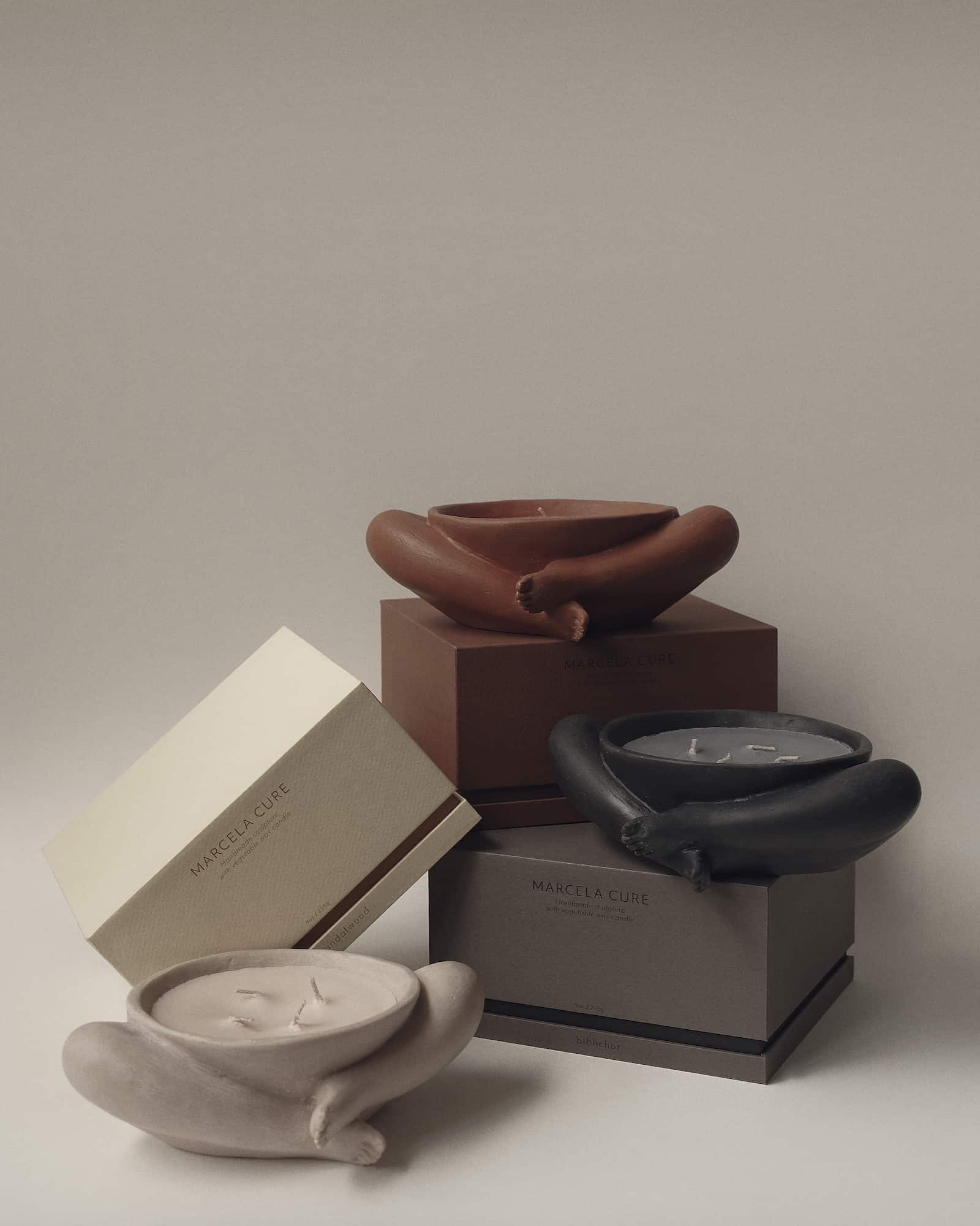 Contemporary Sculptural Candle in Resin and Stone – Biblichor by Marcela Cure — side angle of stacked candles in neutral tone