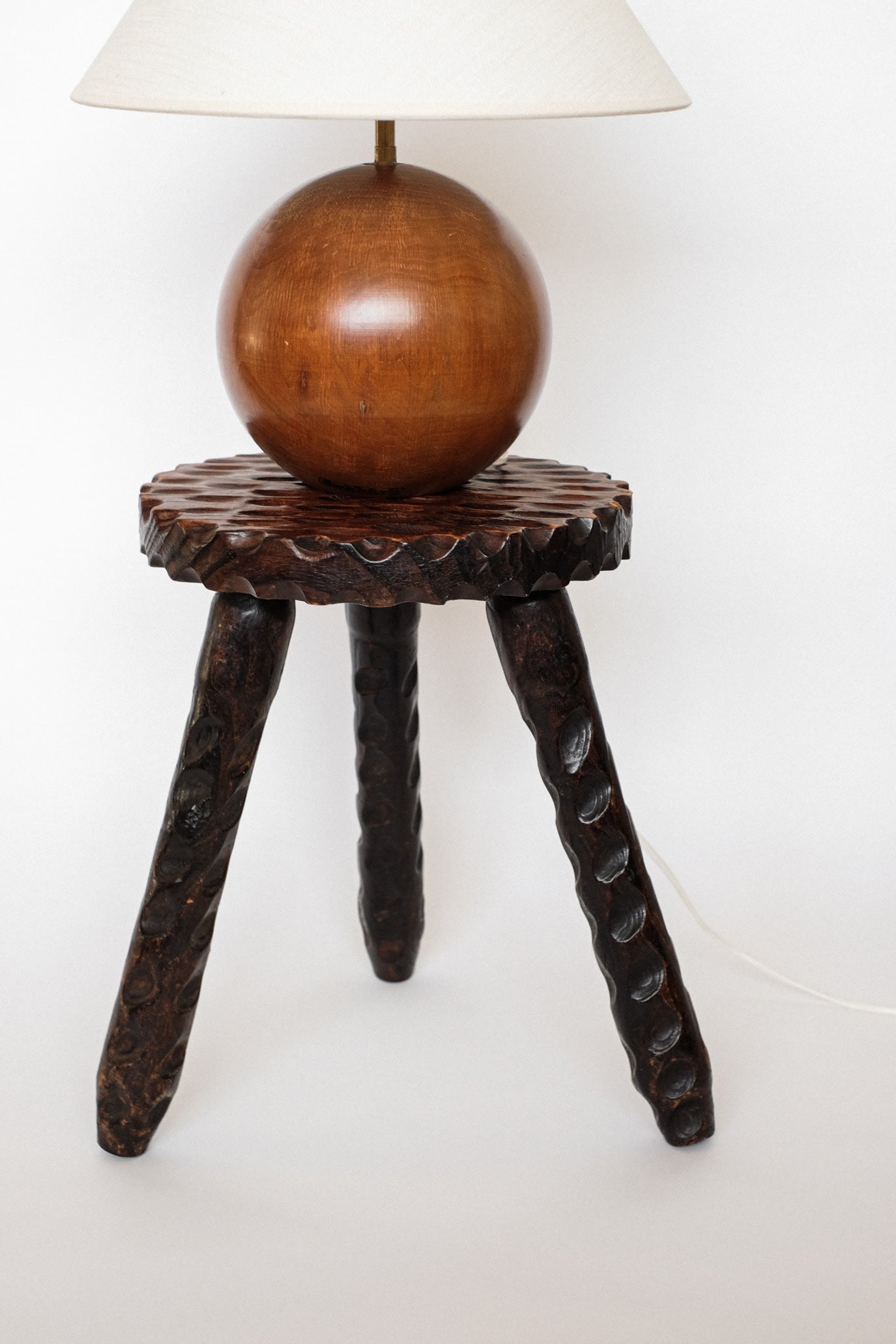 Hand-carved Wooden Tripod Stool — in context
