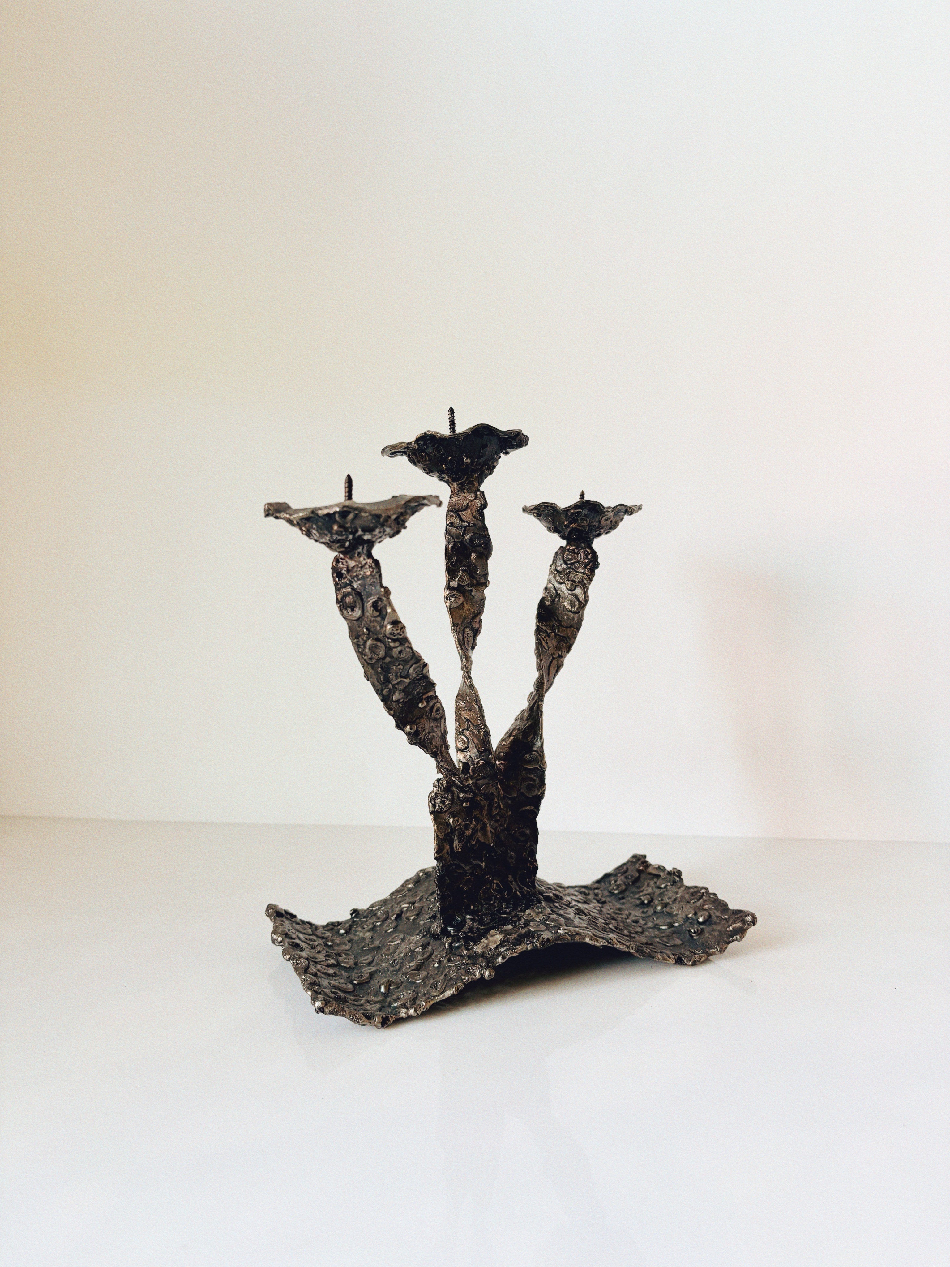Molten Metal Sculptural 3 Arm Candlestick, Brutalist Poland — close-up of textured metal surface