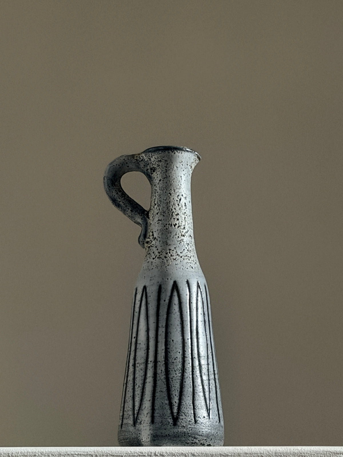 Small handled pitcher by Jacques Pouchain, Dieulefit, France, circa 1960.  — detail view