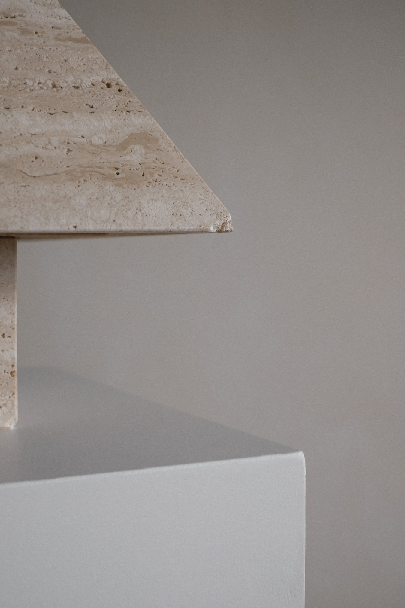 Travertine Pyramid Table Lamp — close-up of light beige travertine material