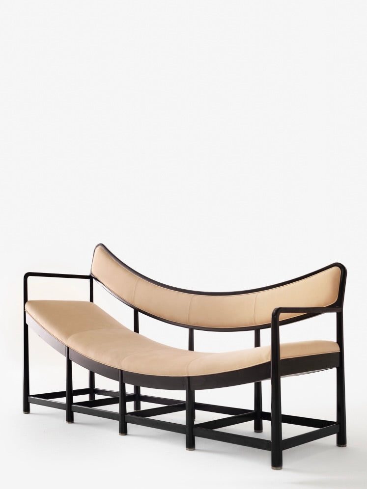Daybed Sofa — close-up of curved beige seat and black frame