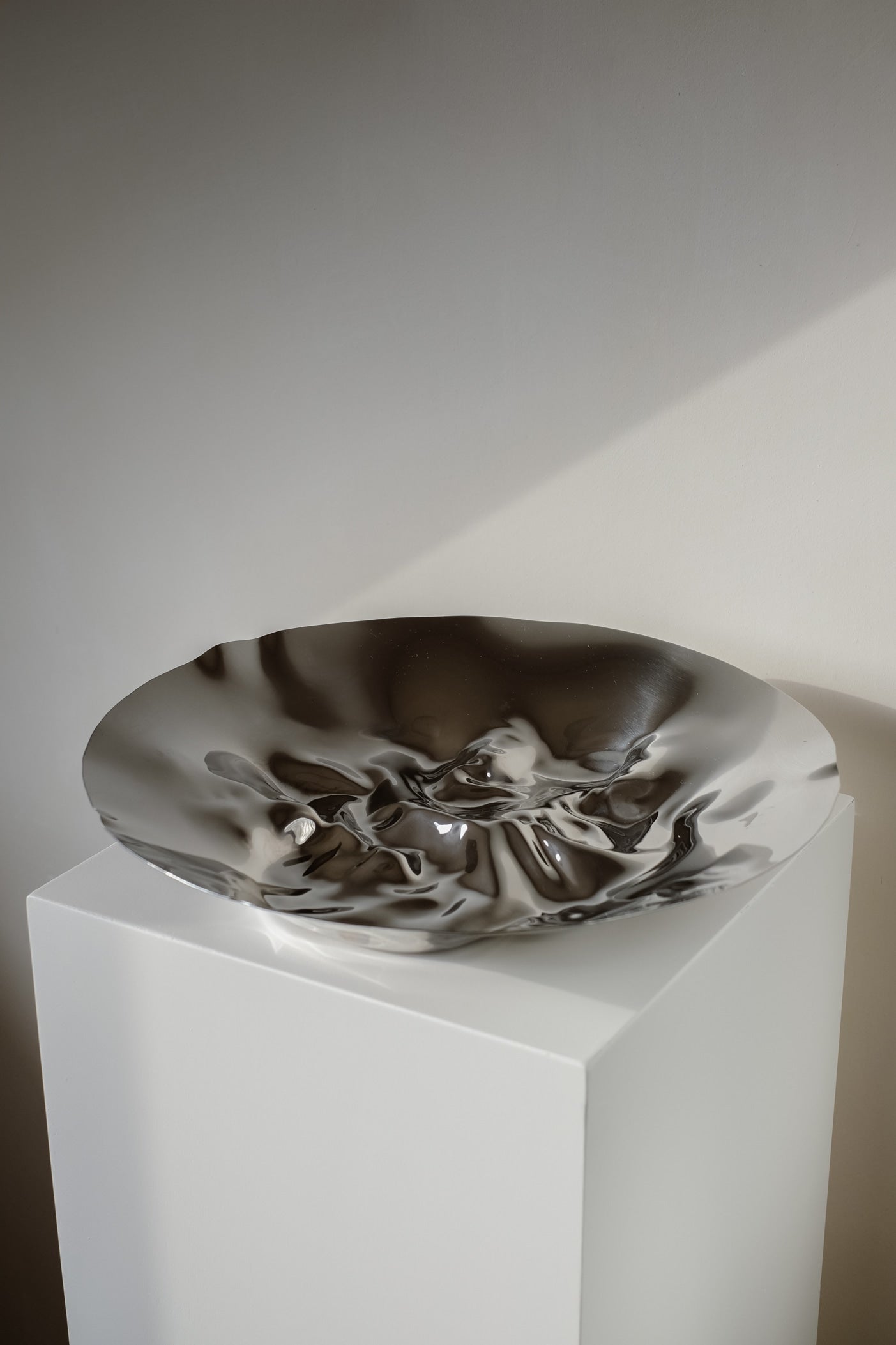 Chrome Curved Decorative Bowl — close-up of shiny chrome surface