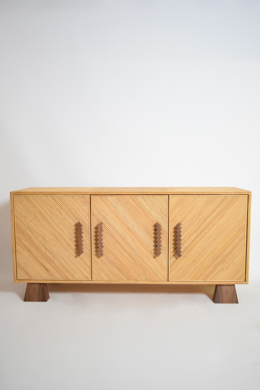 Arrabida Rattan and Walnut Sideboard — front view highlighting textured rattan doors