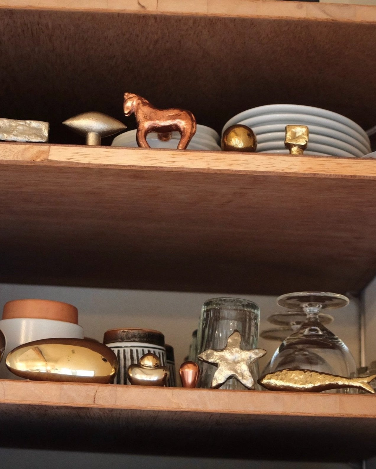 STAR Cabinet Knob/Wall Hook — displayed on wooden shelf with ceramics