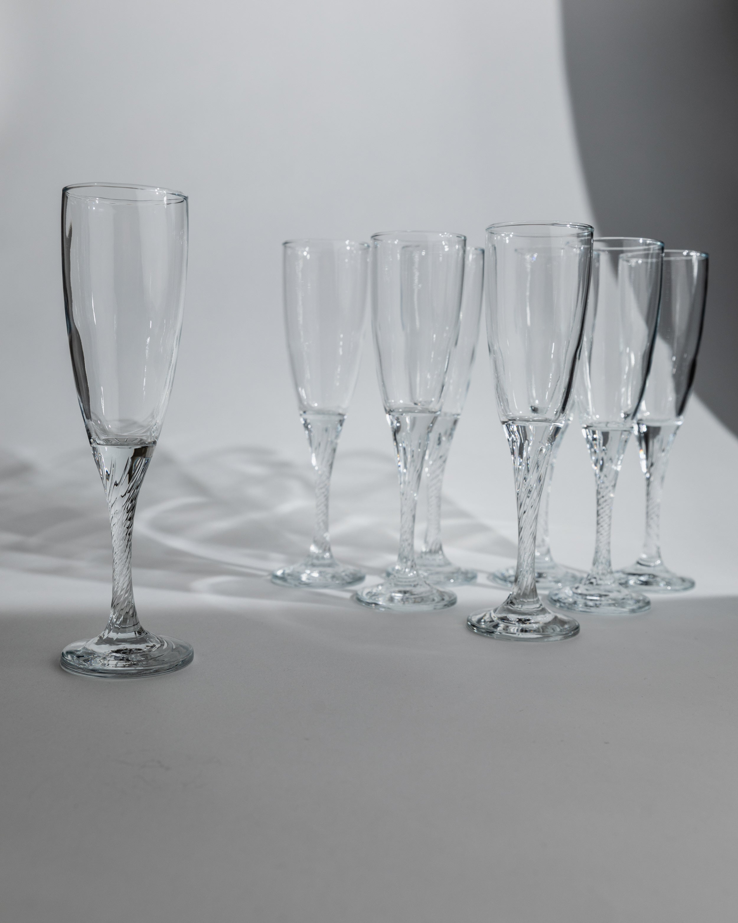 Set of eight 1980s champagne flutes with twisted crystal stems