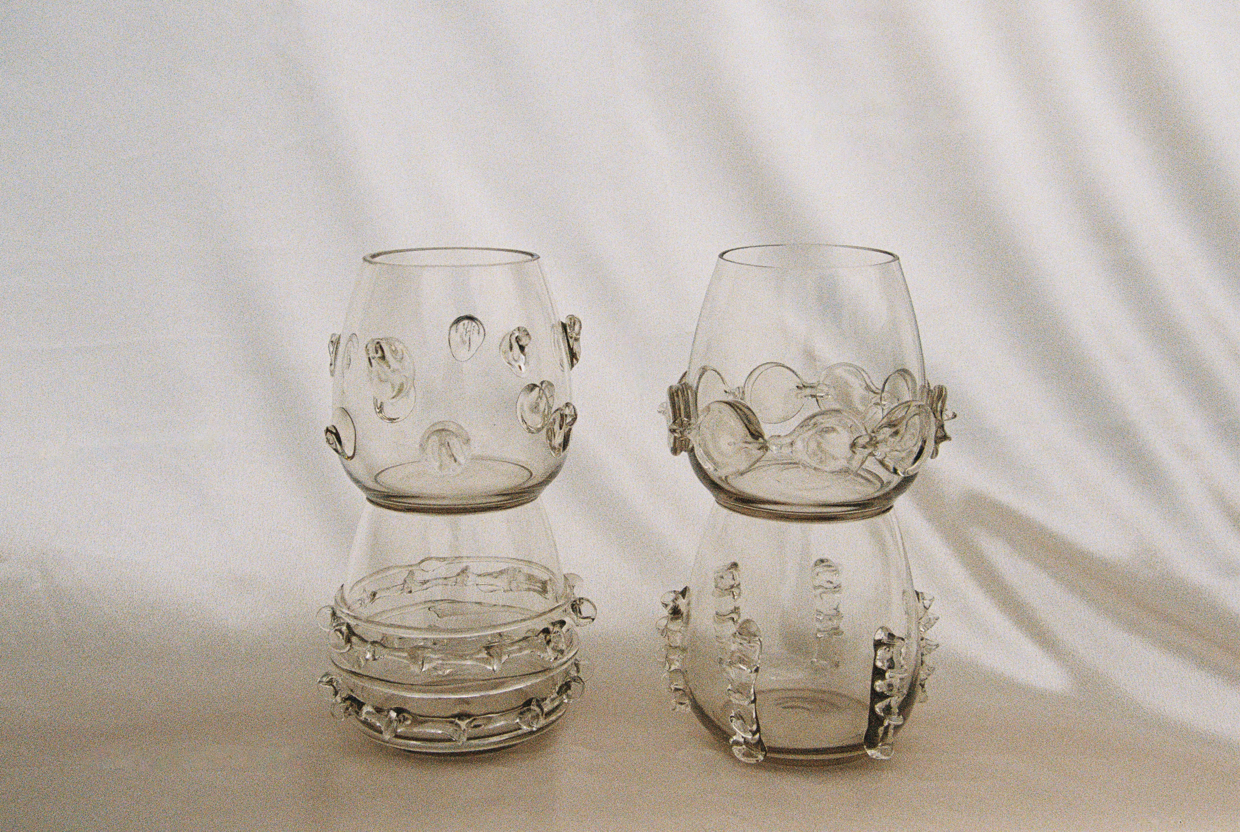 Contemporary Tumblr - Set of four handblown glass vessels — close-up of textured glass details