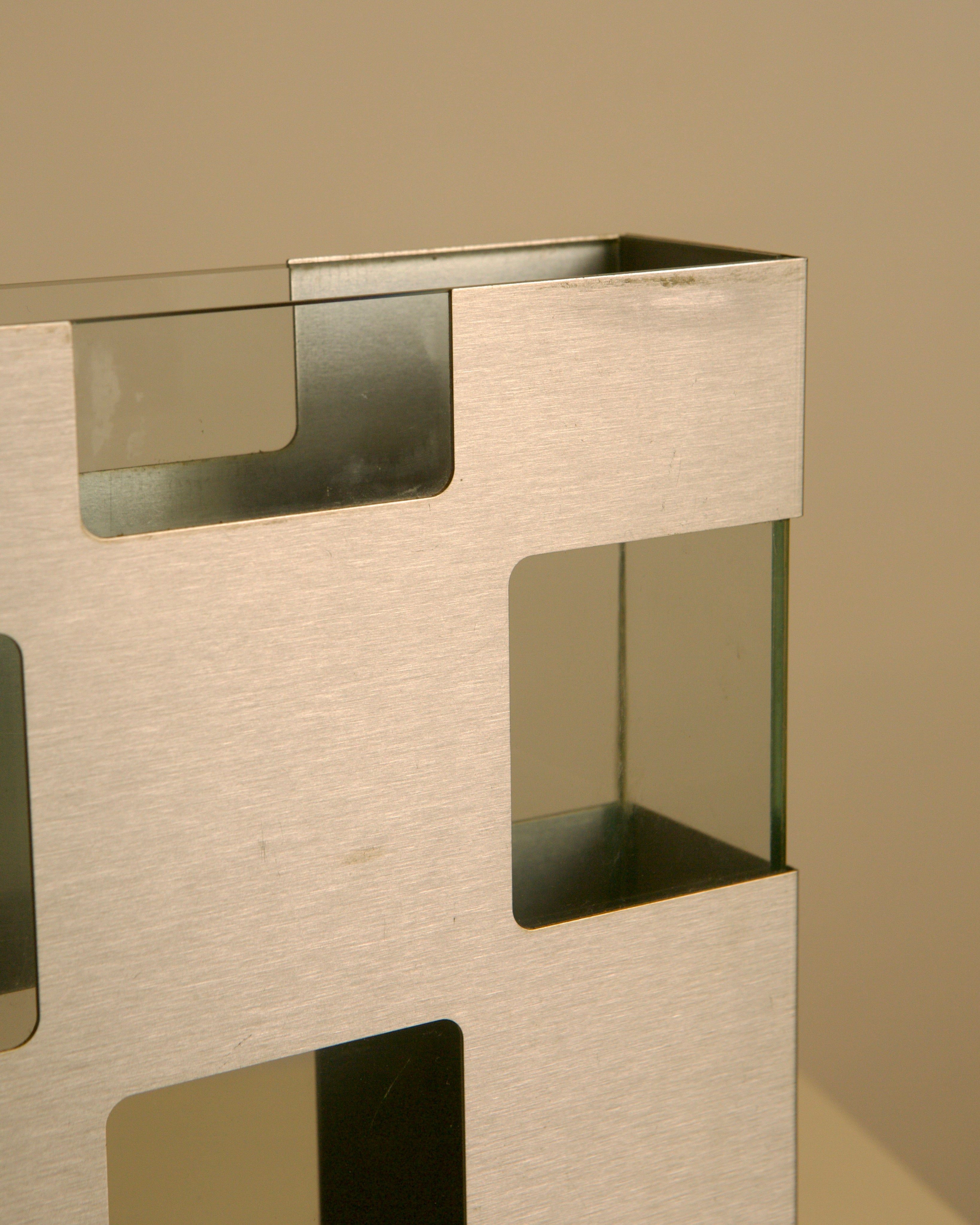 Italian Vase in Metal and Glass c. 1980 — side angle highlighting brushed metal finish
