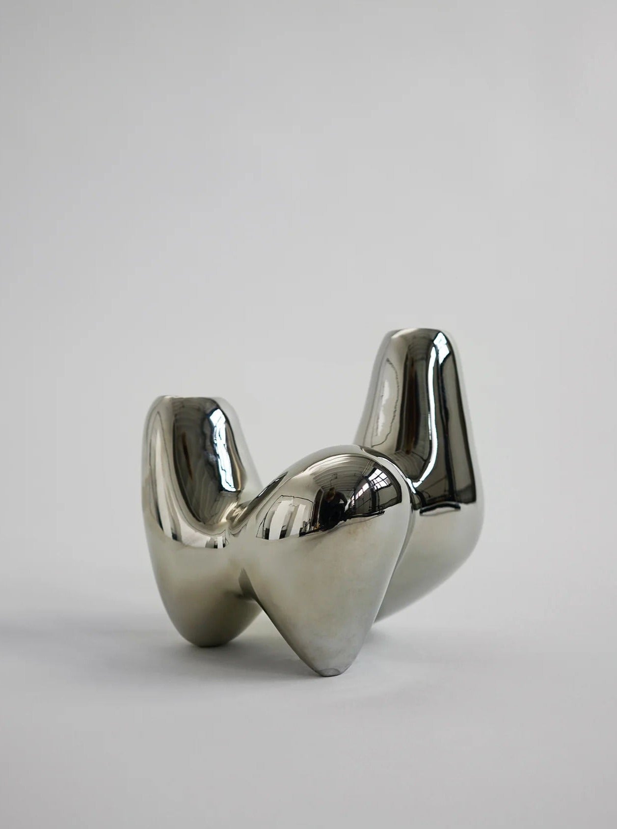 Unity Candleholder - Silver — side angle showing reflective surface