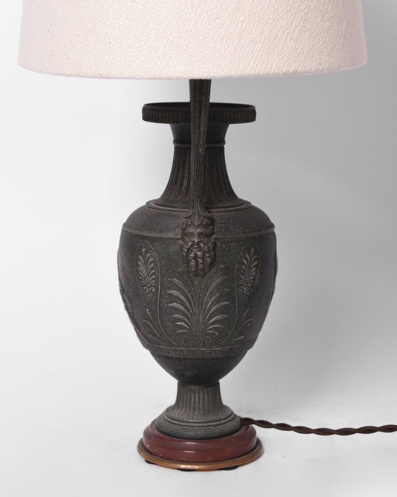 Neoclassical blackened iron lamp, 1920s — close-up of textured iron base