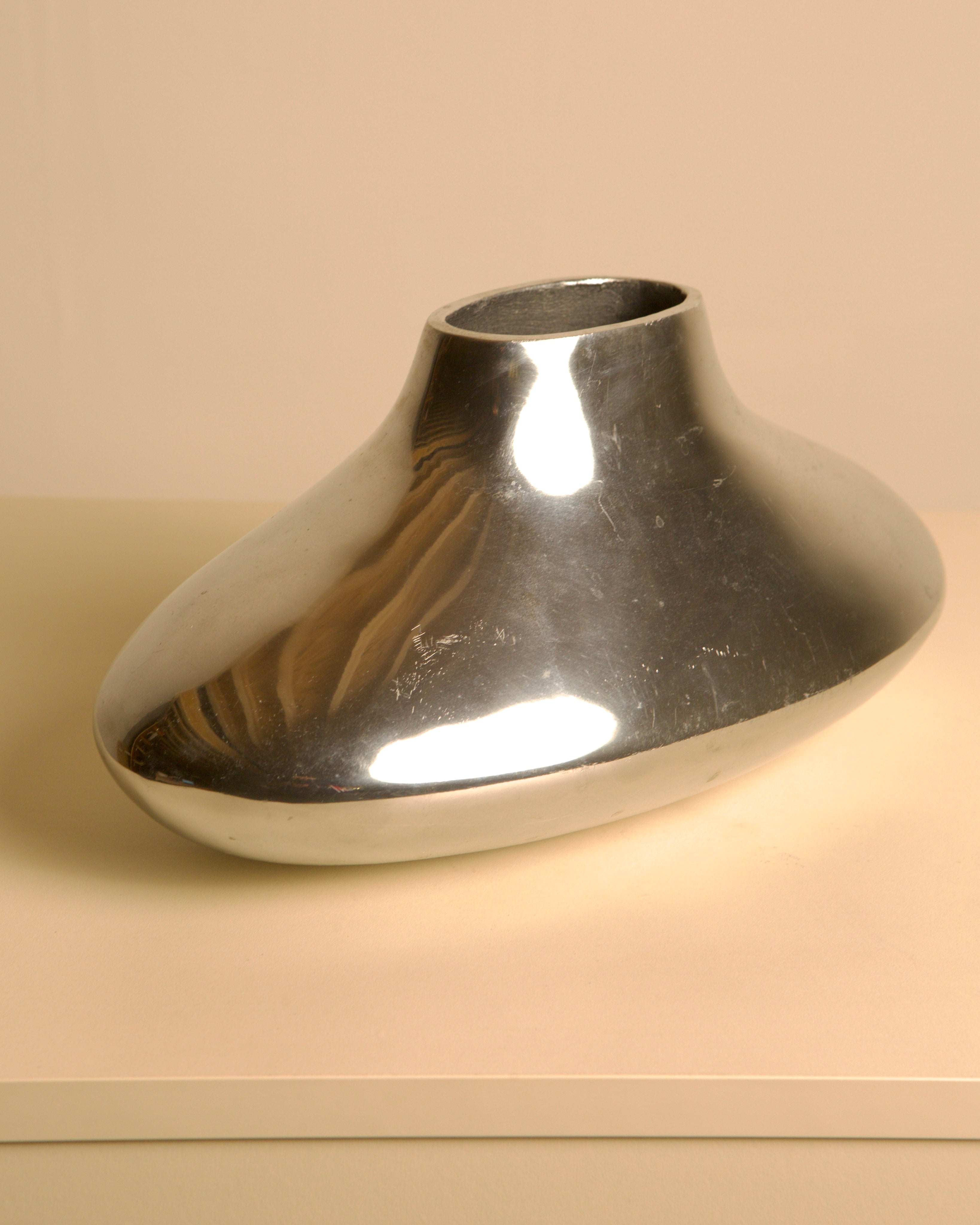 Plat Vase in Cast Aluminum 80's — angled view on neutral background