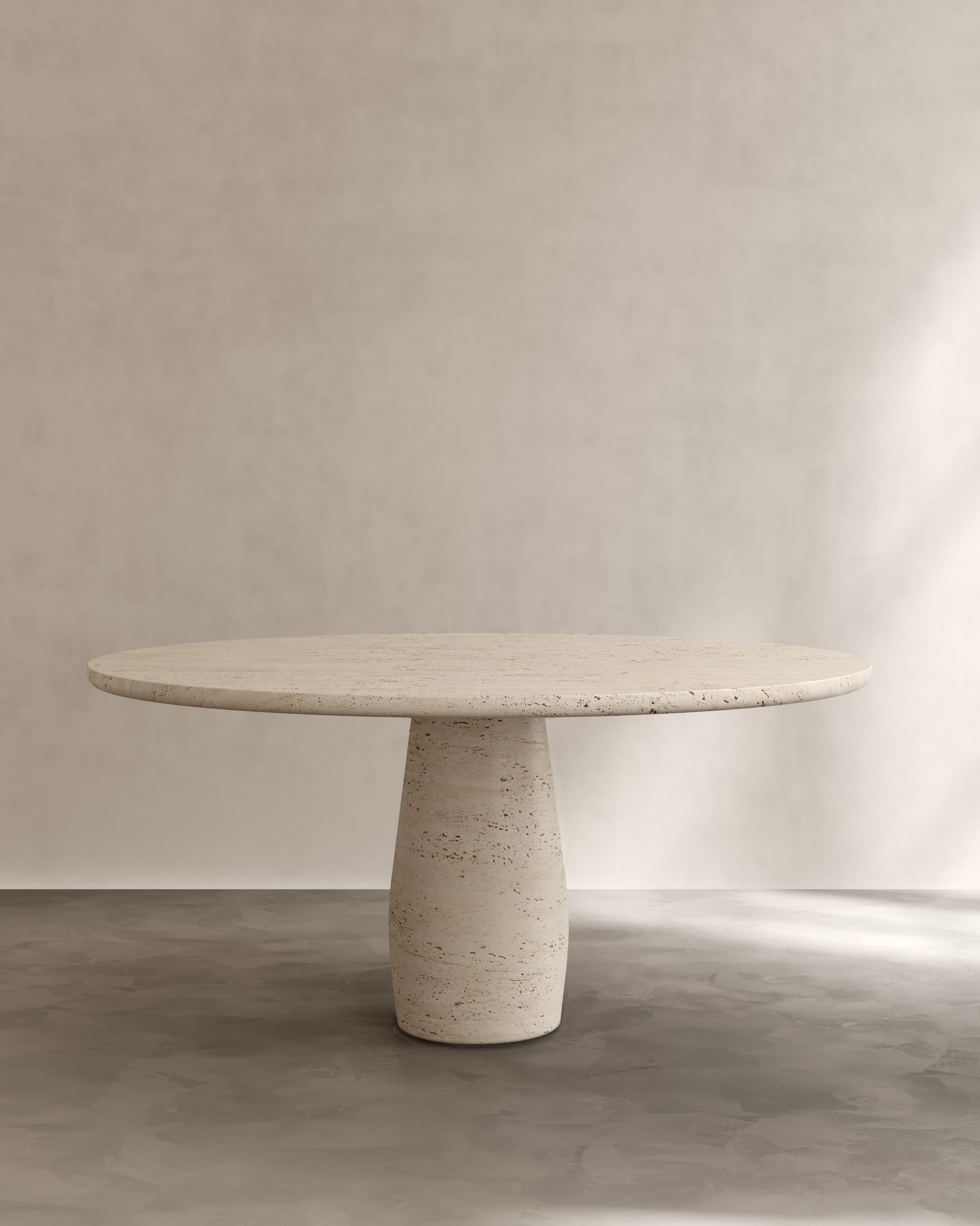 Raffaella Table III — round stone dining table in minimalist setting