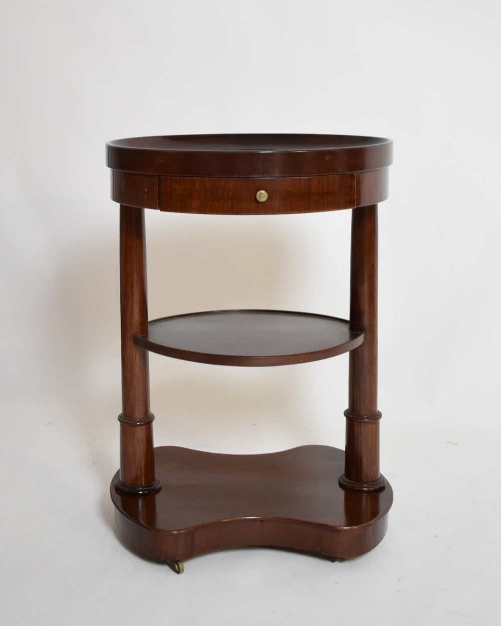 Pair of Mahogany Kidney Ovale Tables, XIXth c. — front view with round top and lower shelf