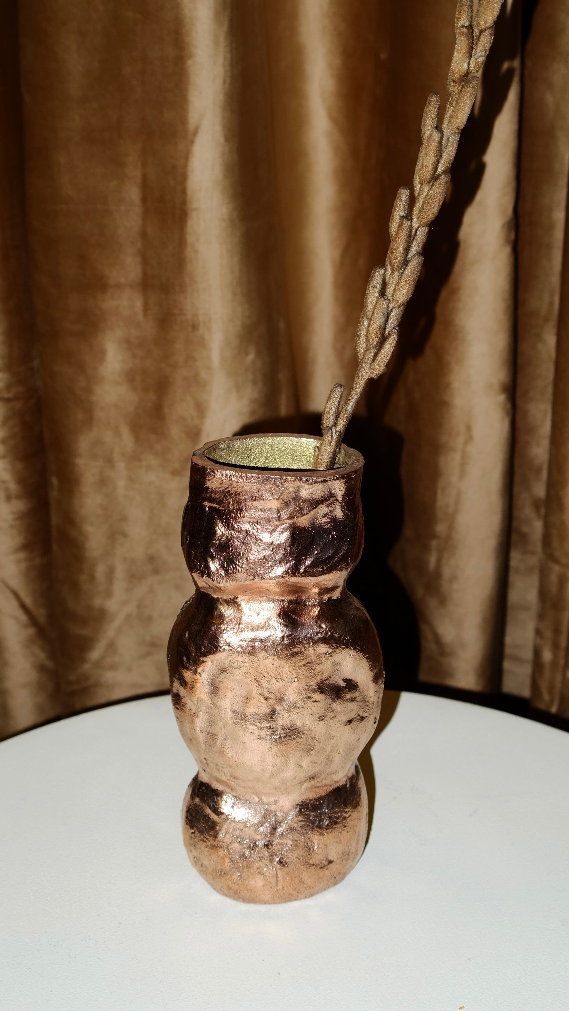 OLIO Vase No. 4 — close-up of handcrafted metallic surface with dried stems