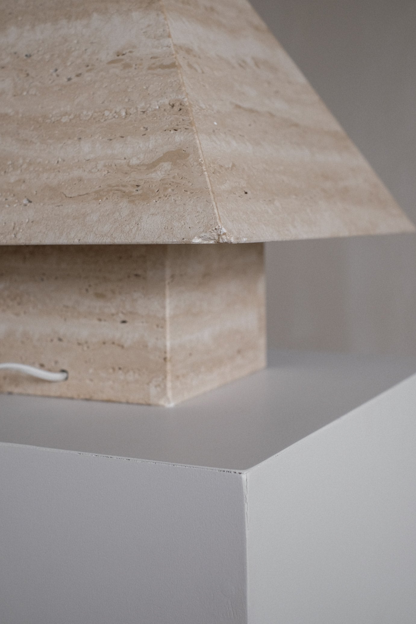 Travertine Pyramid Table Lamp — close-up of beige travertine shade