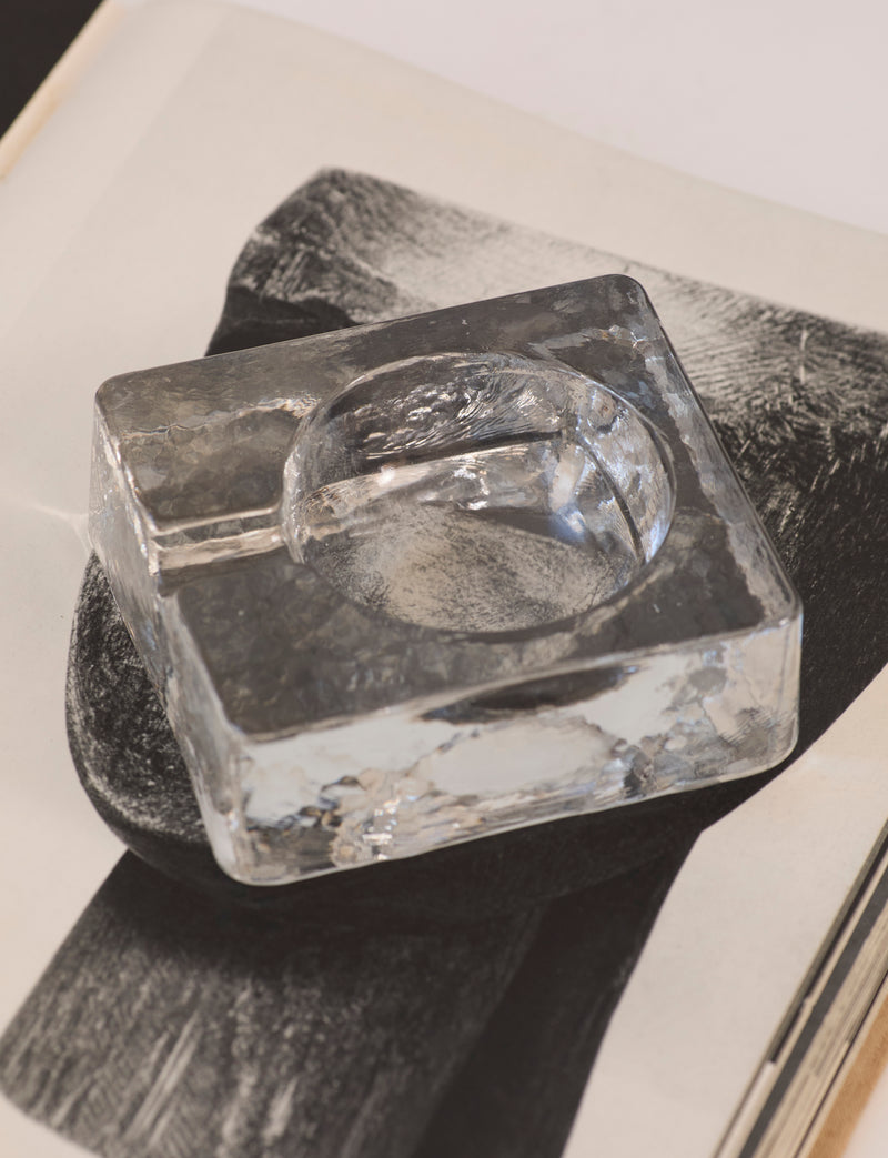 Scandinavian Clear Ashtray in Glass — top view on textured book page