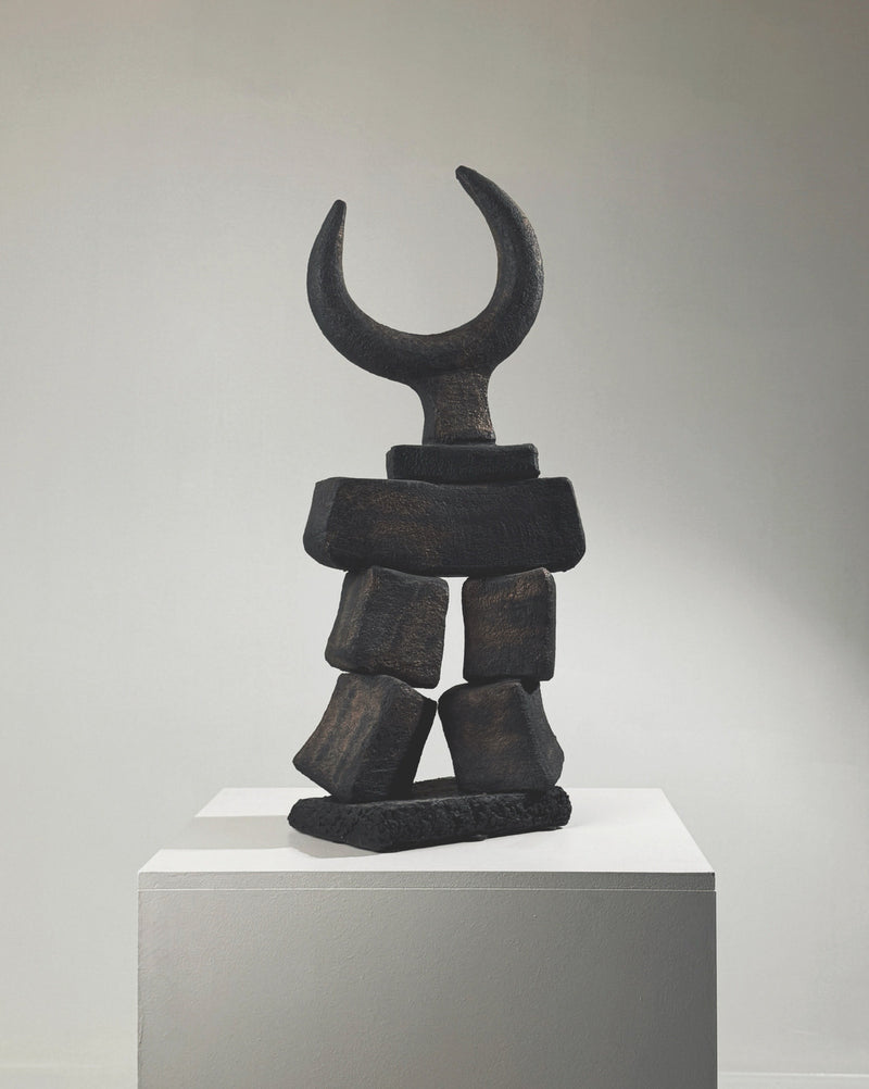 Black stone Toro totem sculpture by Dominique Pouchain with crescent moon