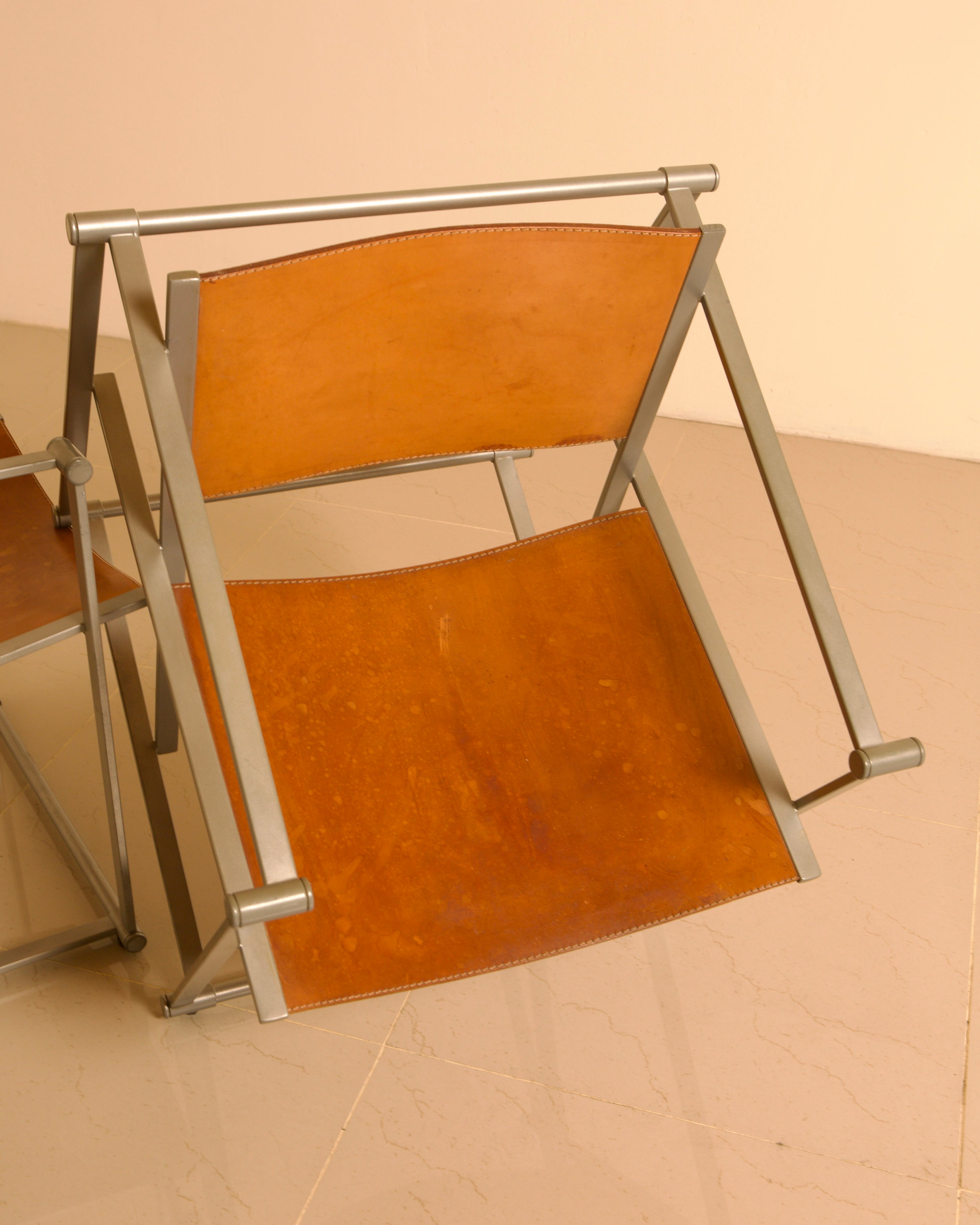 Pair of "FM62" Armchairs by Radboud van Beekum for Pastoe, 1980s — angled view showing leather seat and metal frame