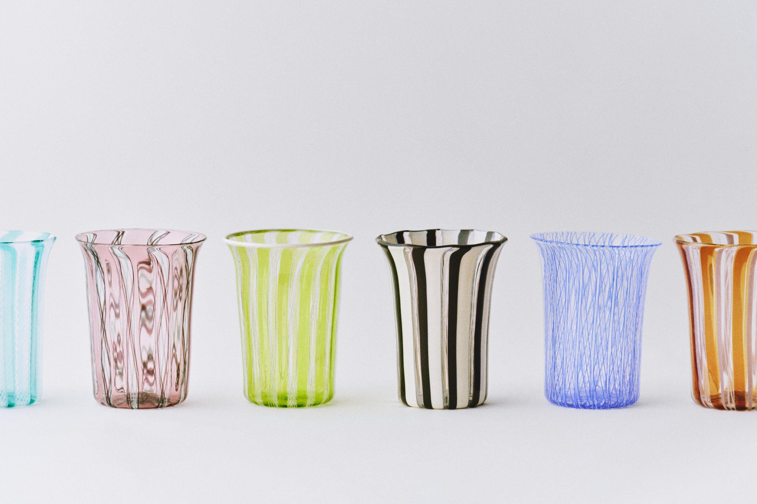 Clara Glasses - Set of four — arranged in a row on white background