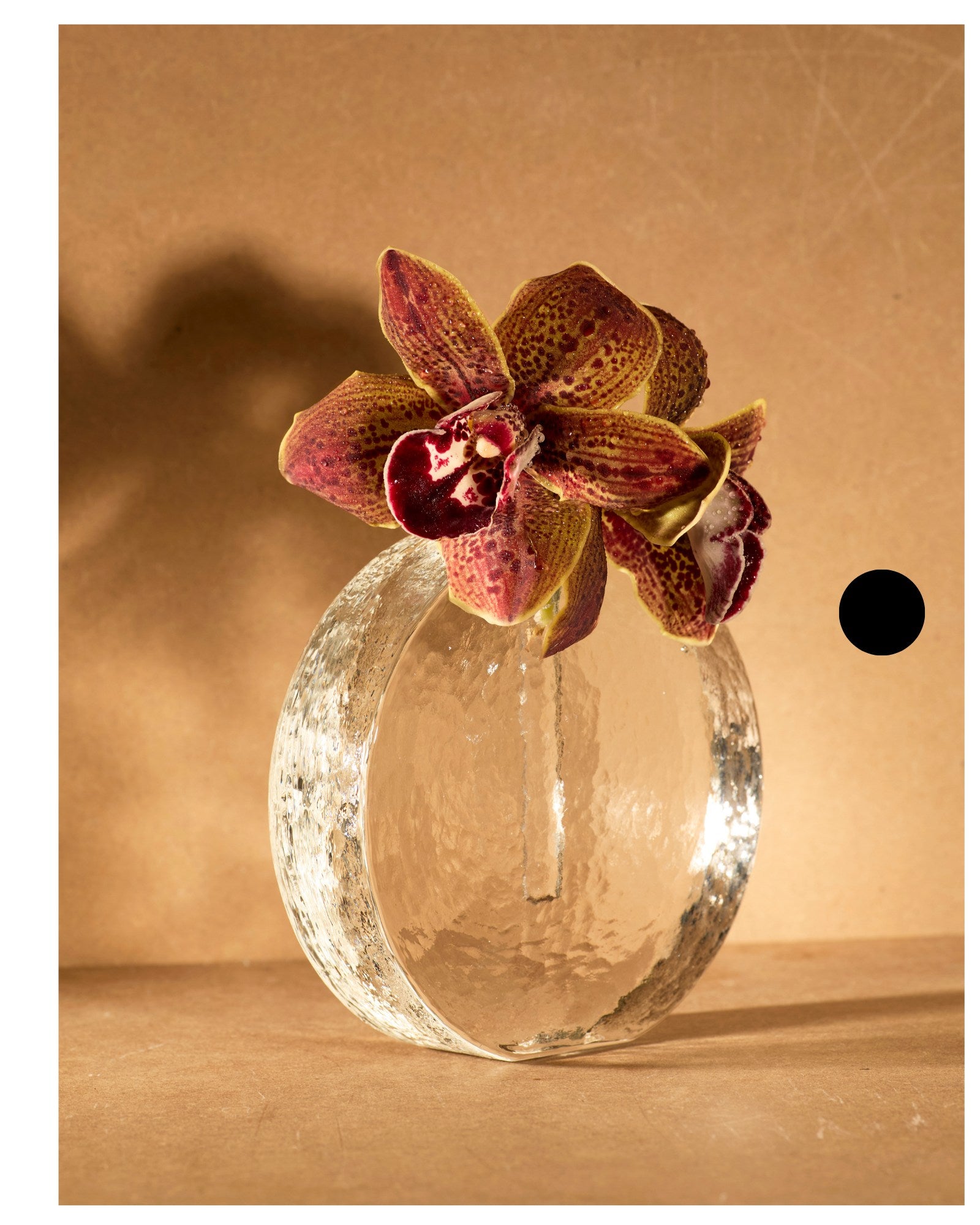 Scandinavian solifleur vase in clear glass c. 1960 — top view with orchid arrangement