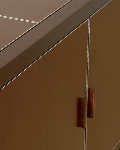Close-up detail of Morfeo cabinet leather handles and stitching
