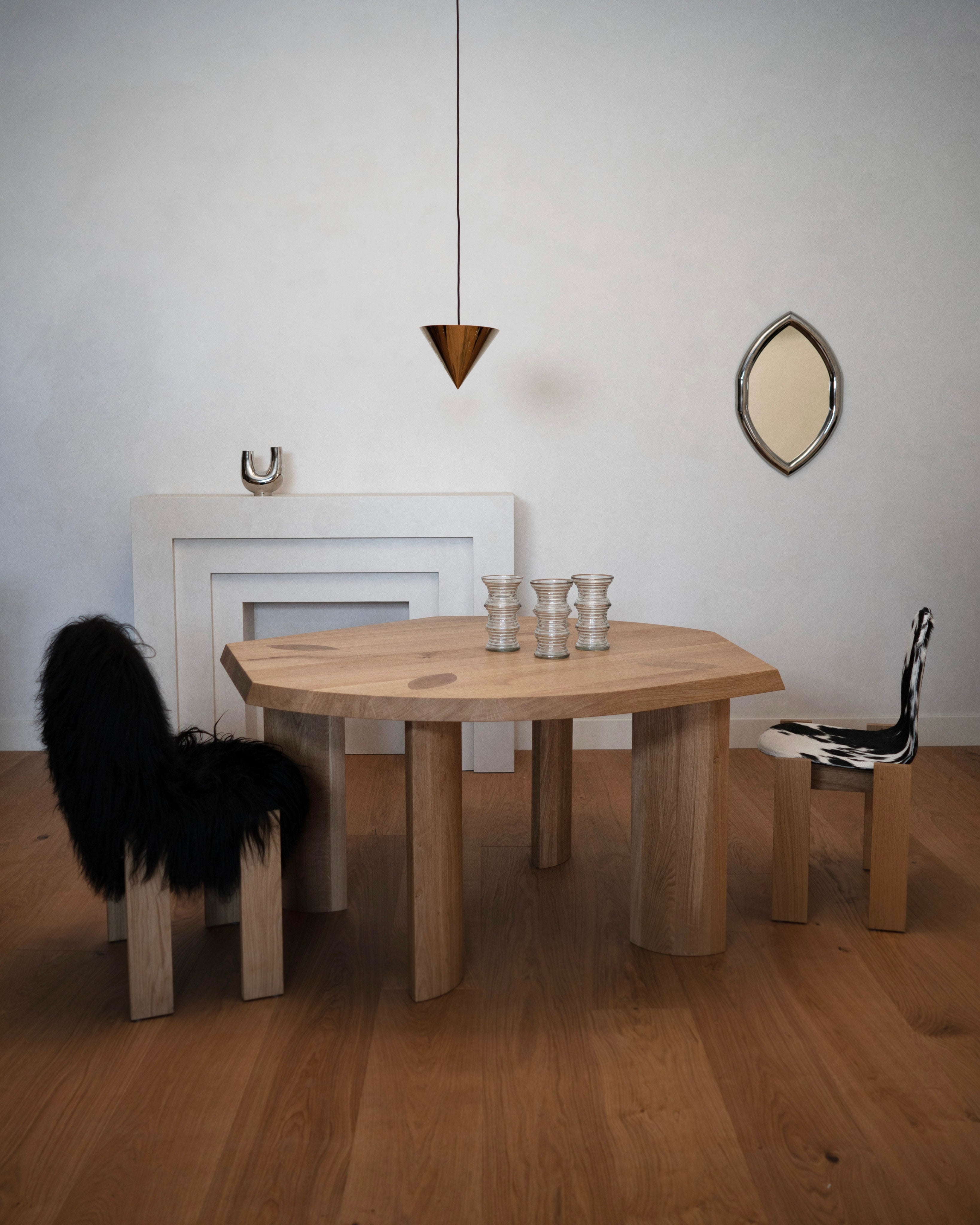 Gilbert Edge Dining Table - Dark Oiled Oak — side angle in modern dining room setting