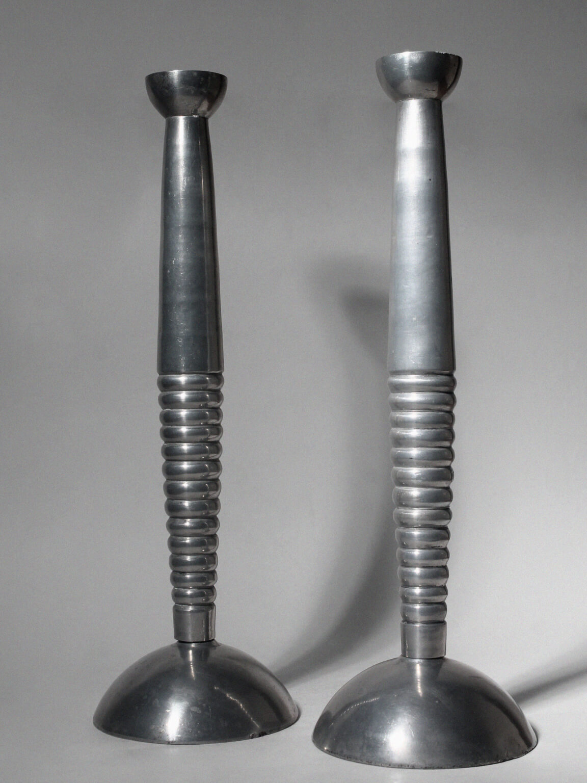 Pair Of Massive Rimmed Aluminum Candle Holders — detail view