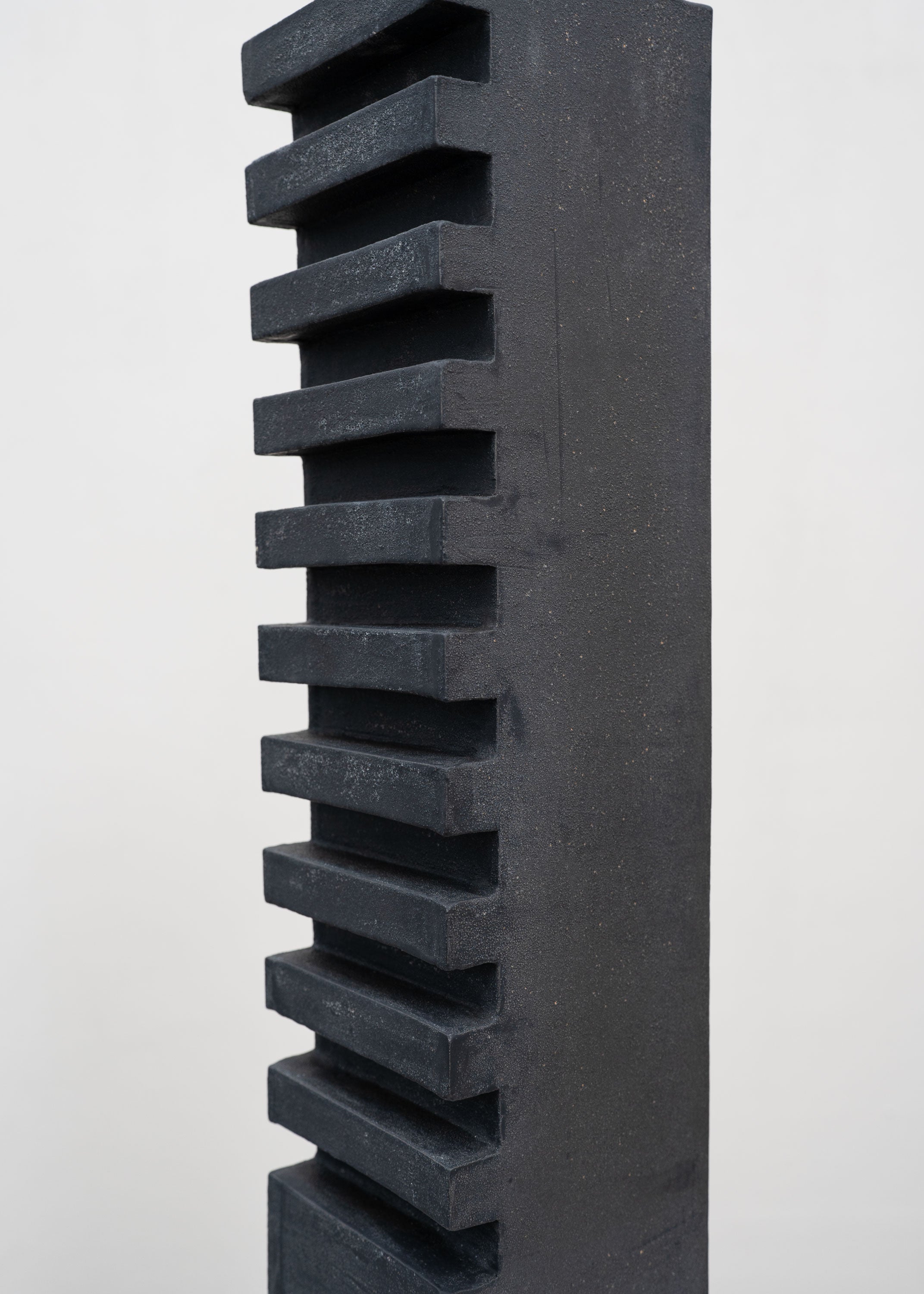 Tall Sculptural Stoneware Vessel by Tom Roberts — top view of textured black surface