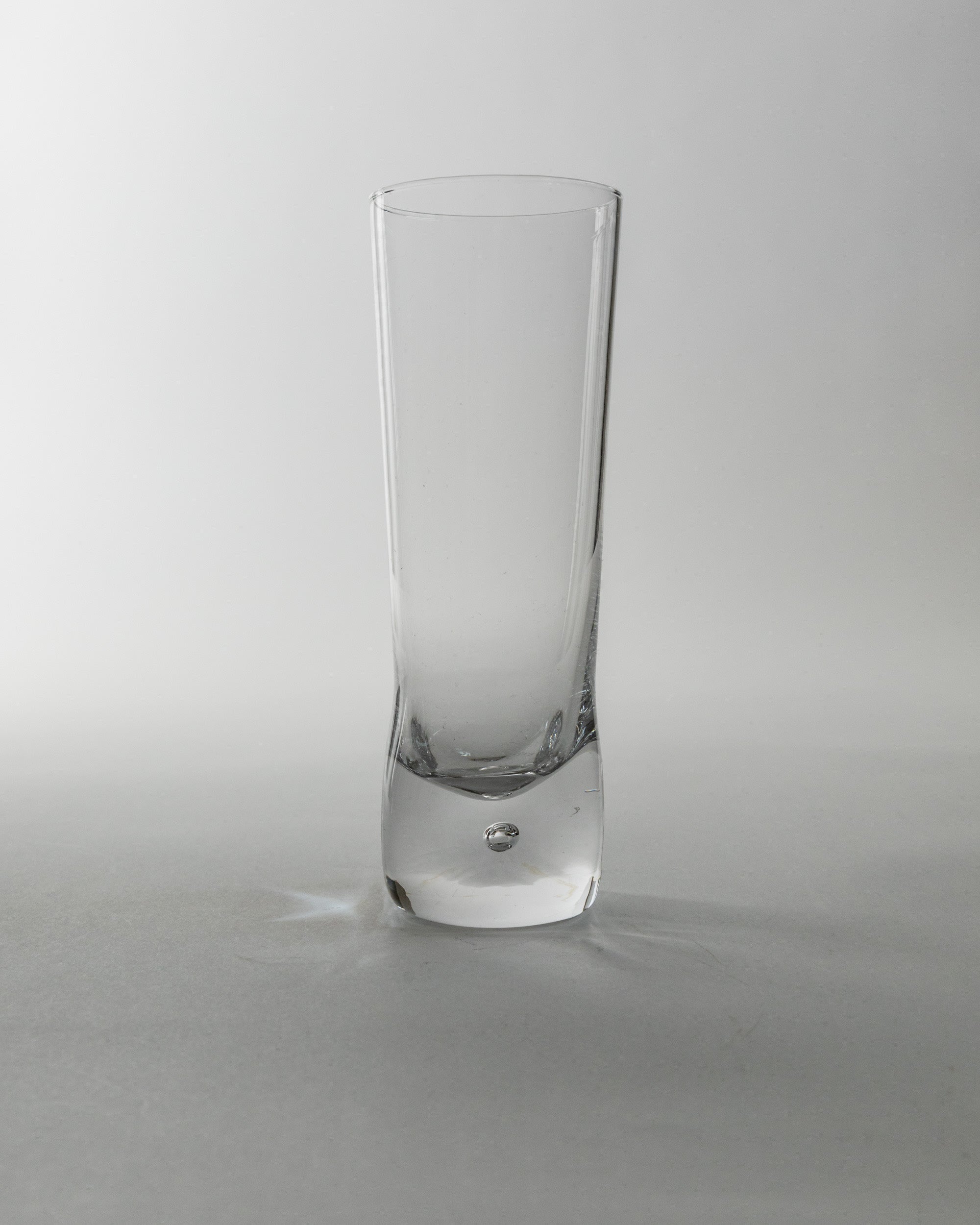 Set of 6 Vintage Murano Glasses, Italy 70s — front view of clear glass in studio setting
