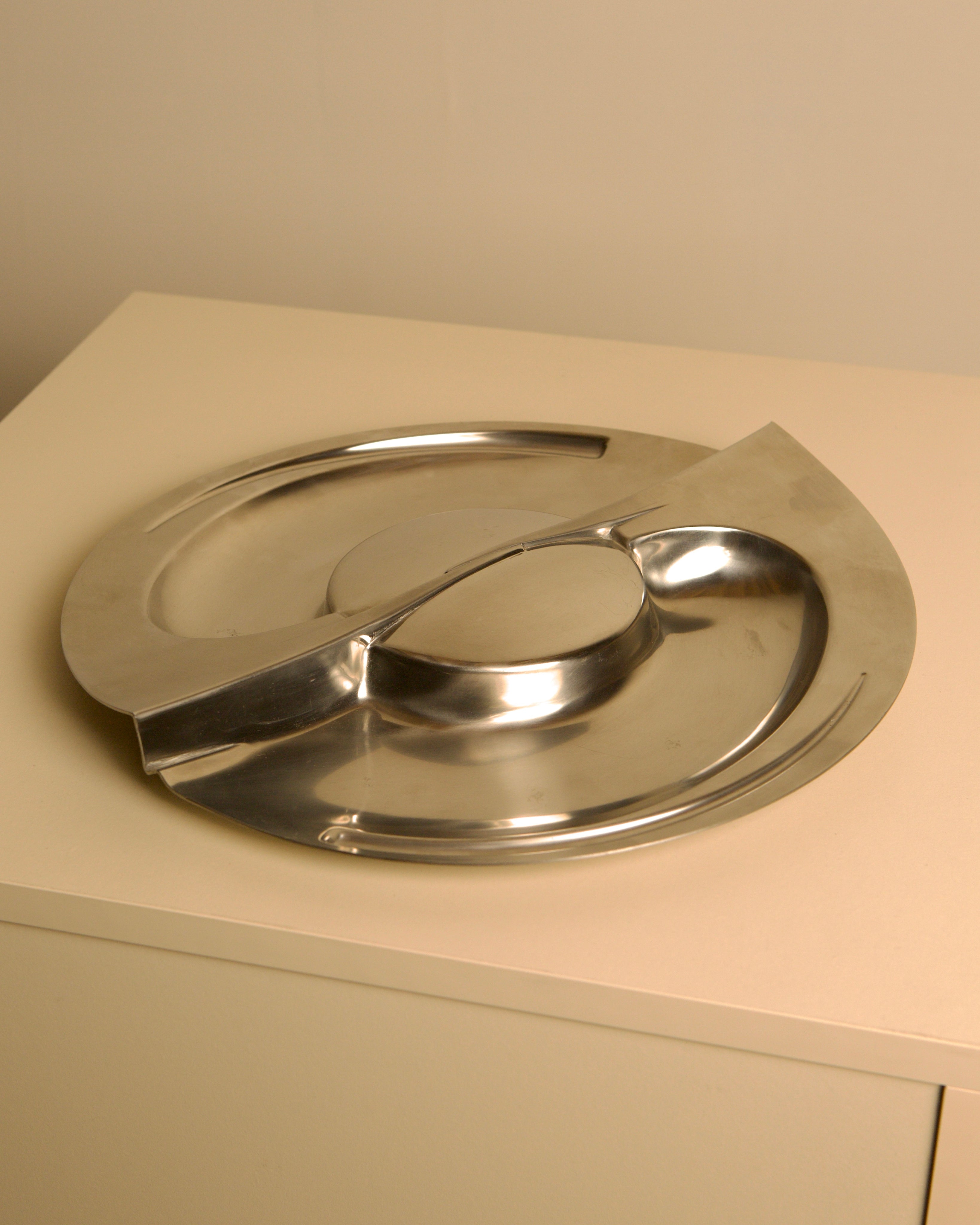 Large metal storage compartment 'Forma Orizzontale Circolare' by Carmelo Cappello for Ales | The Oblist — polished stainless